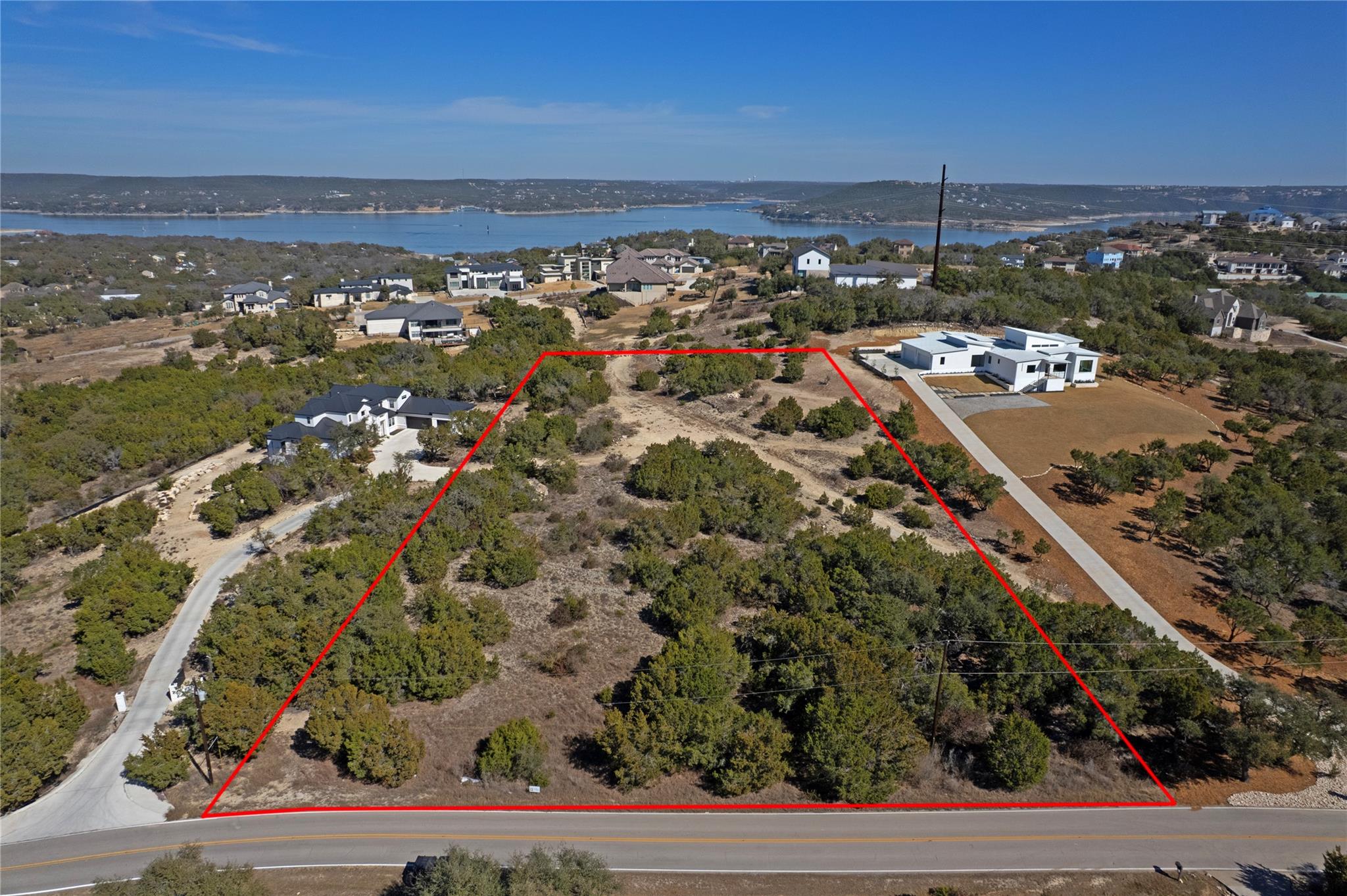 Aerial overview of property's location with a lar