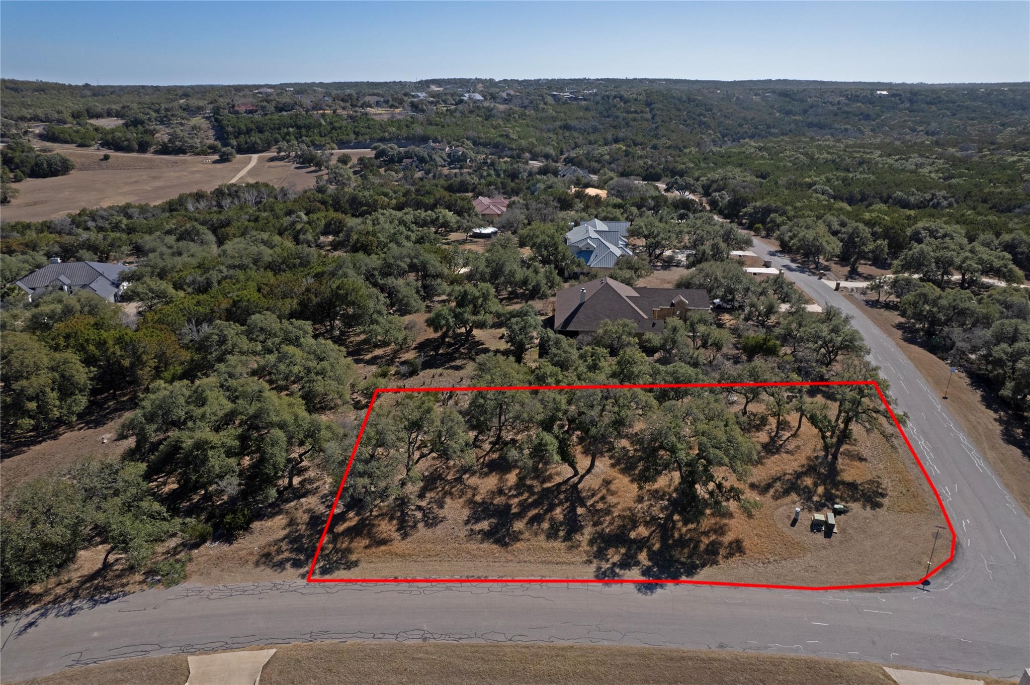 Aerial view of property's location with a heavily