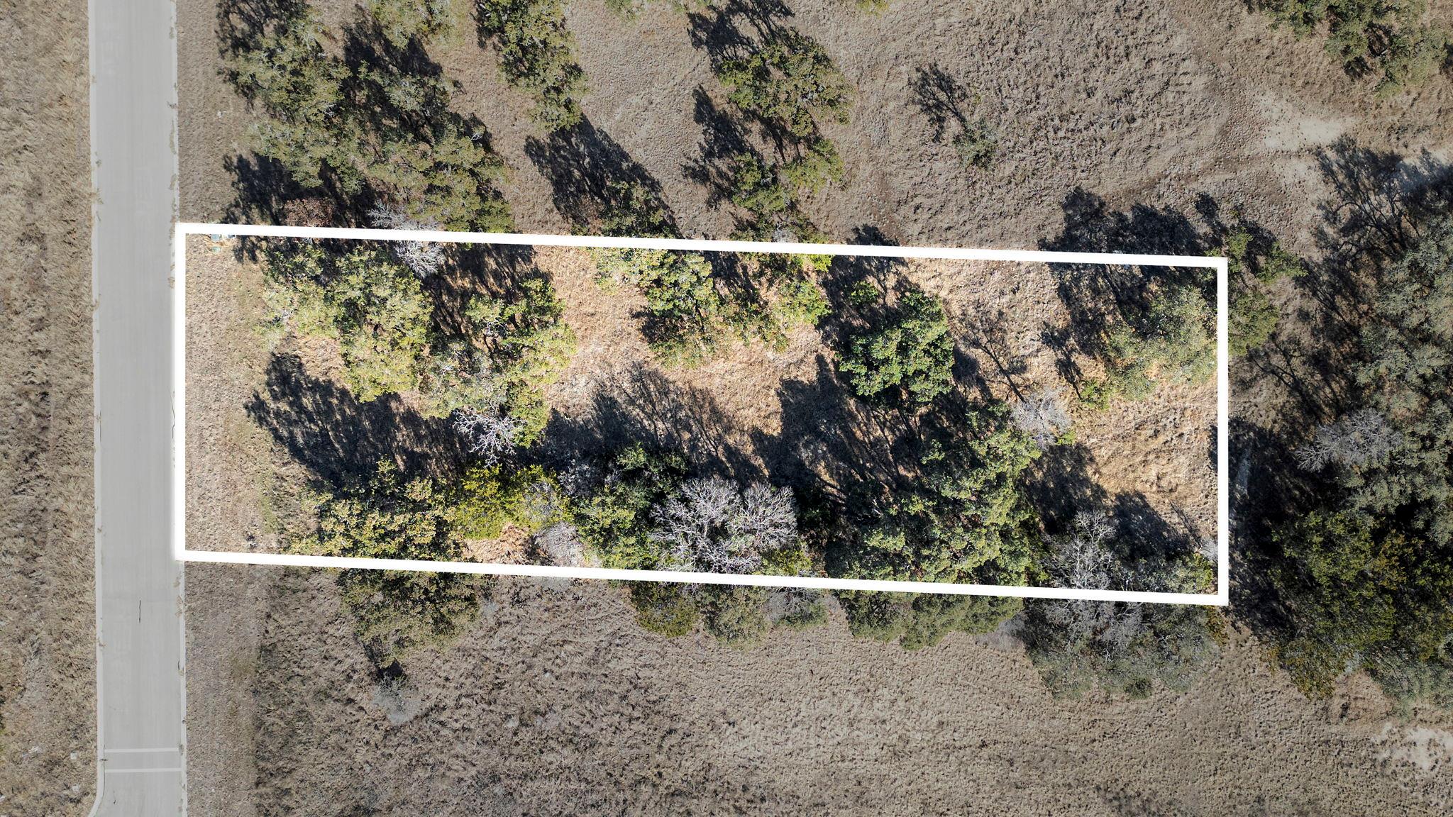 Aerial view of property and surrounding area with
