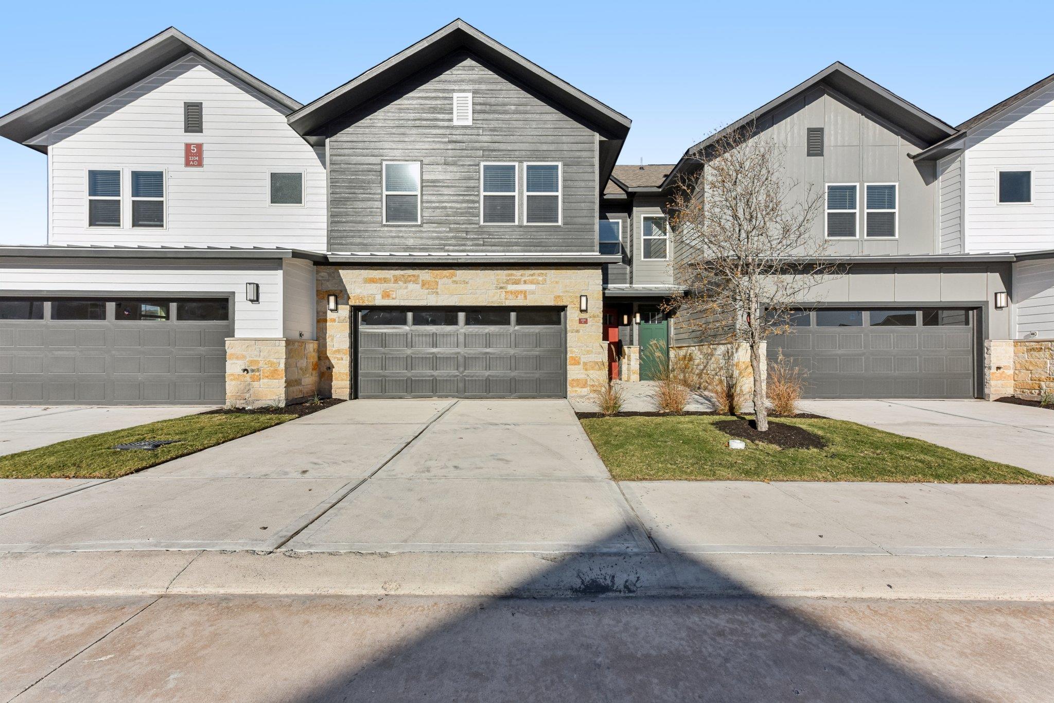 View of front of property featuring stone siding,