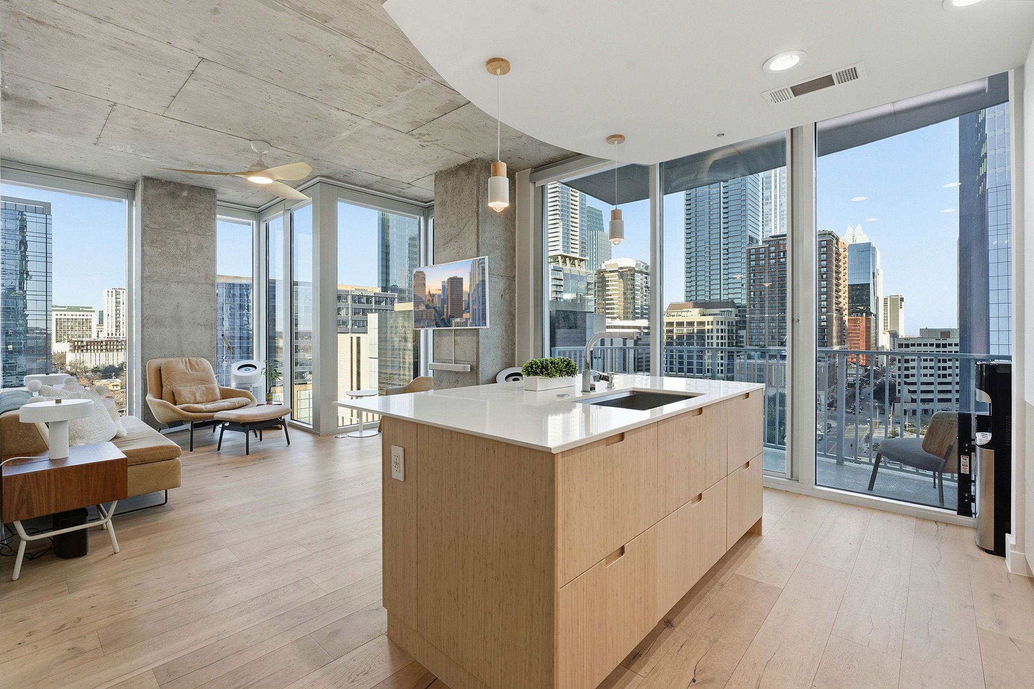 Kitchen featuring light wood finish cabinetry, mo