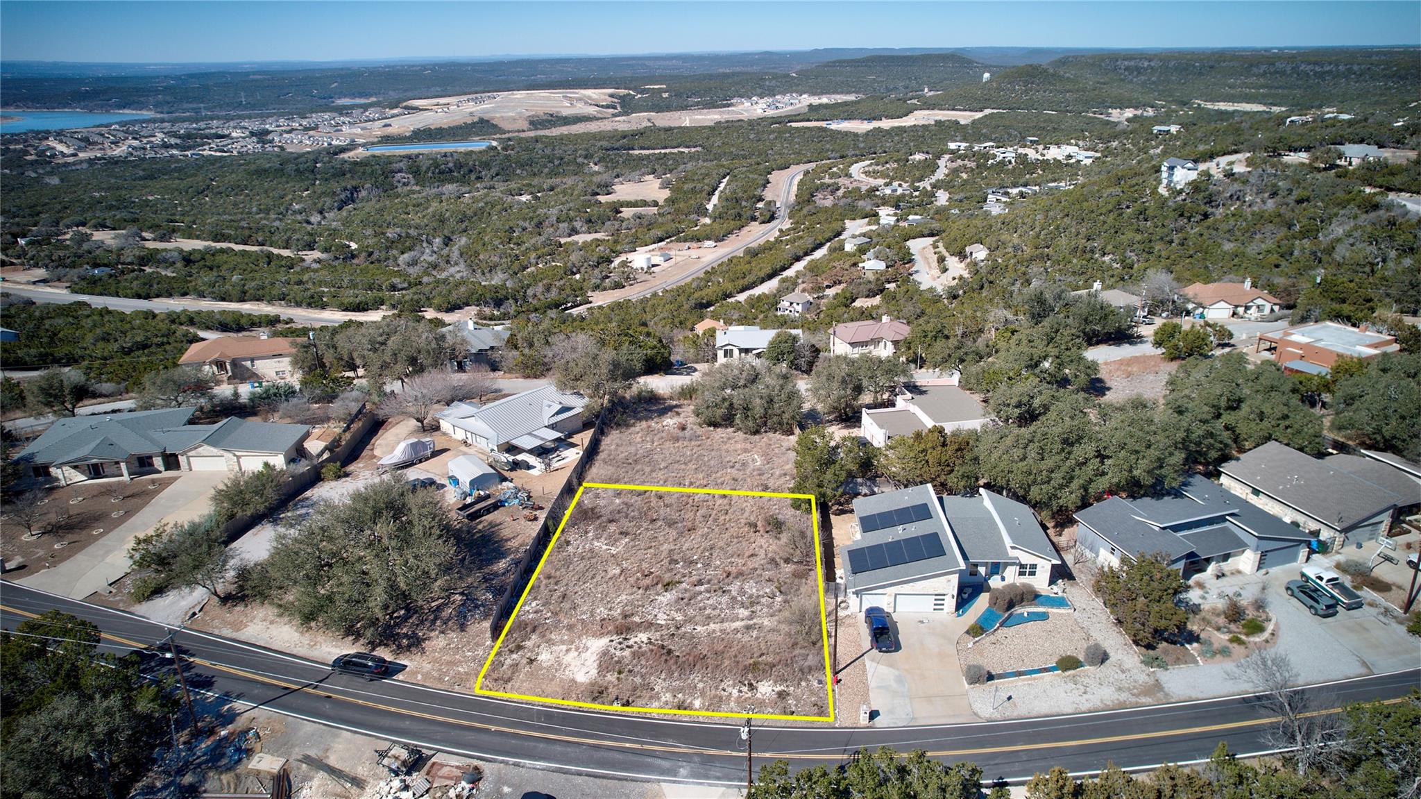 Aerial view of residential area with property par