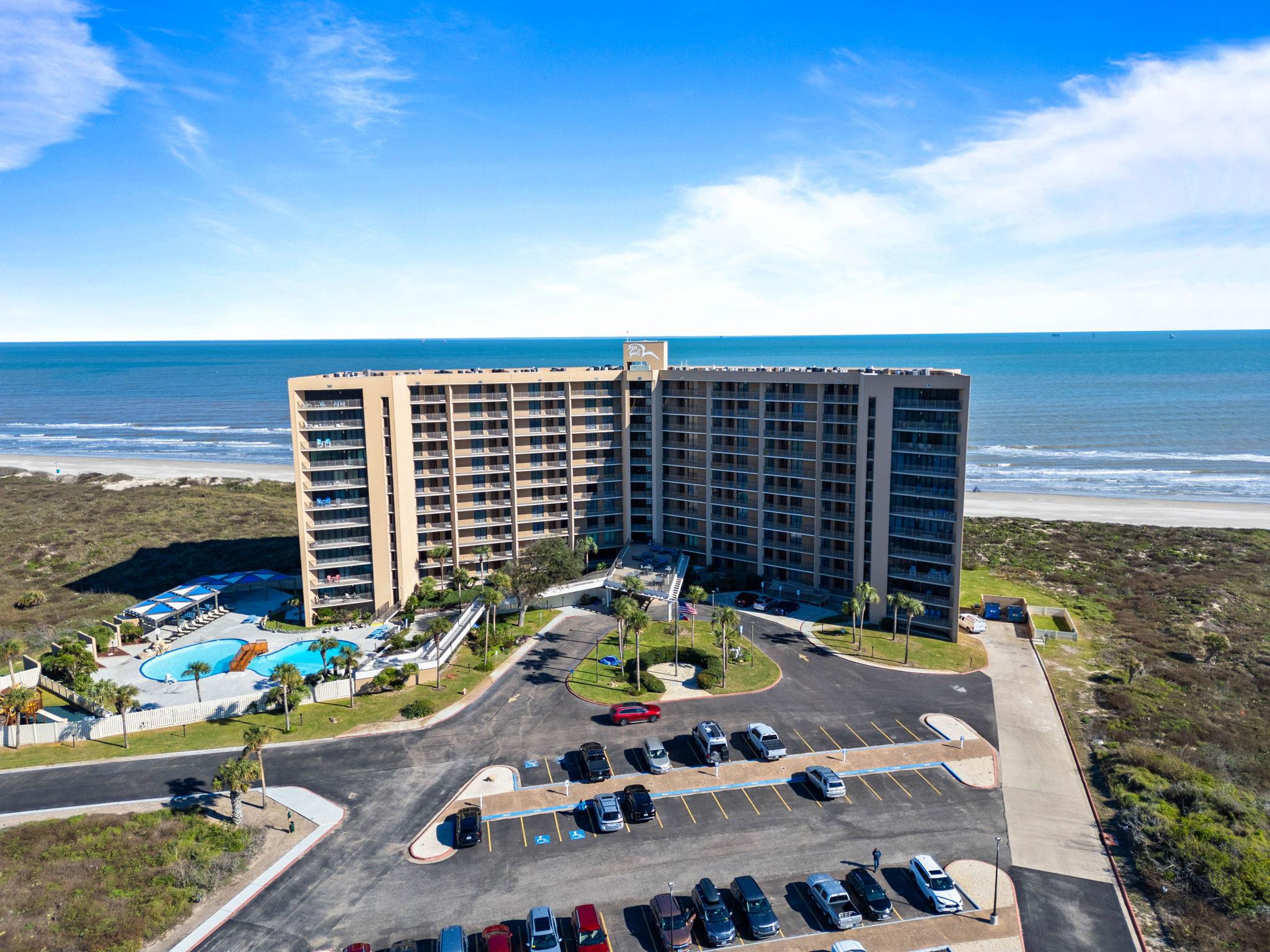 Drone / aerial view of apartment complex / buildi