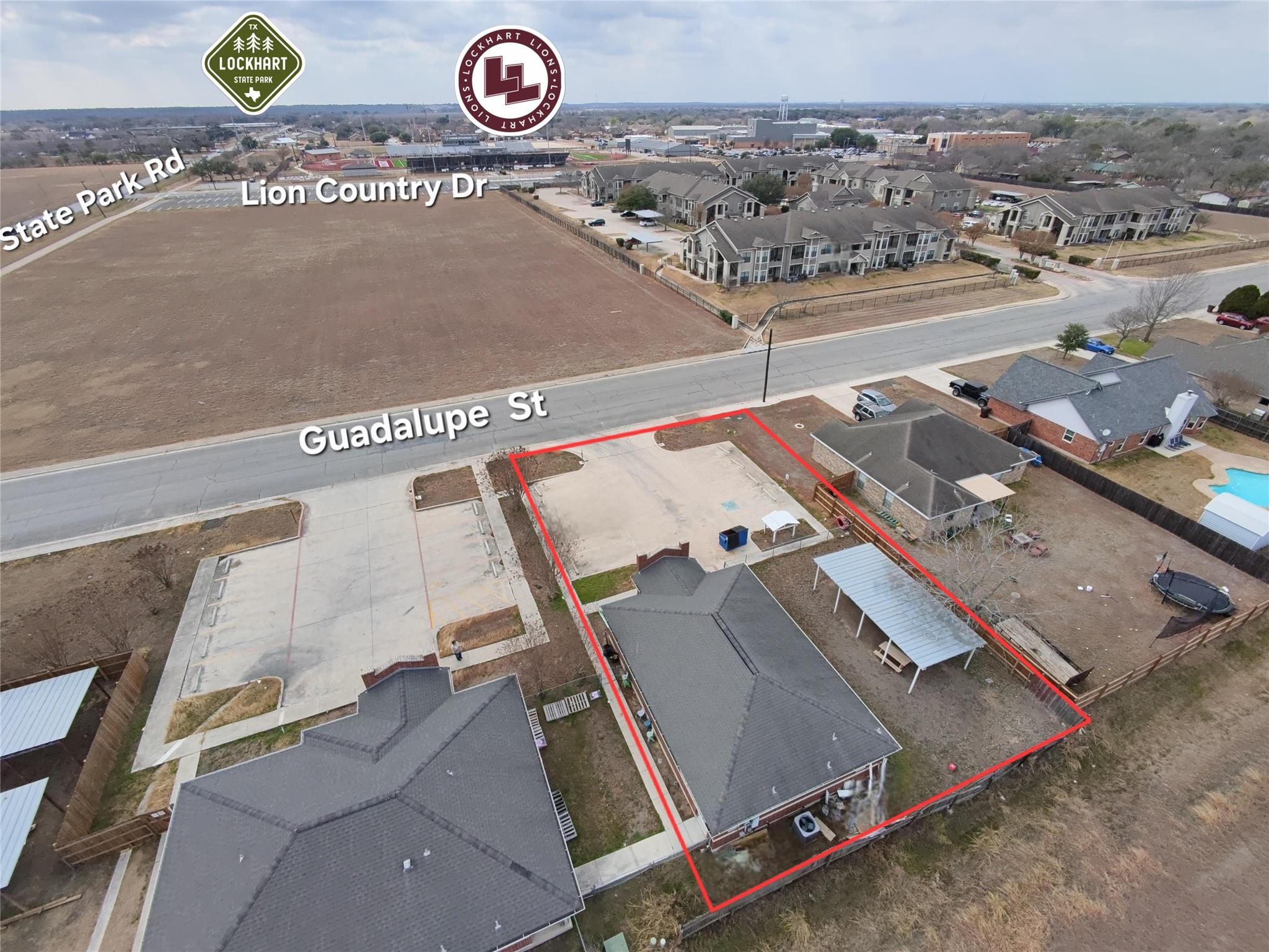 Aerial view of residential area with property bou