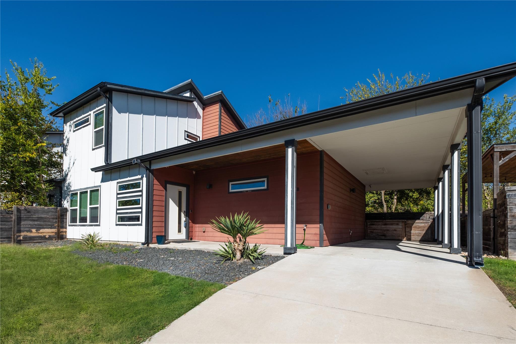 Contemporary house featuring board and batten sid