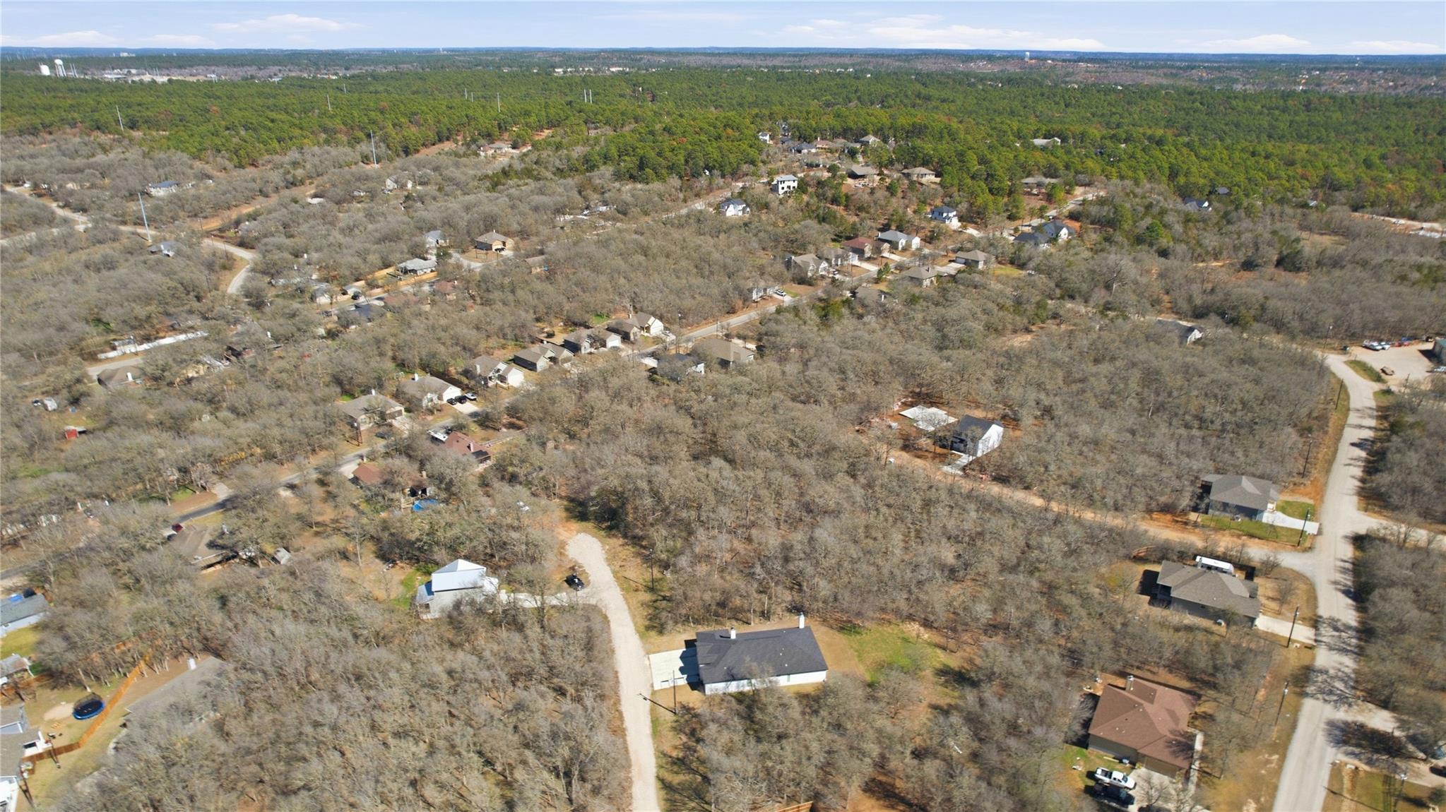 Aerial view of property and surrounding area with