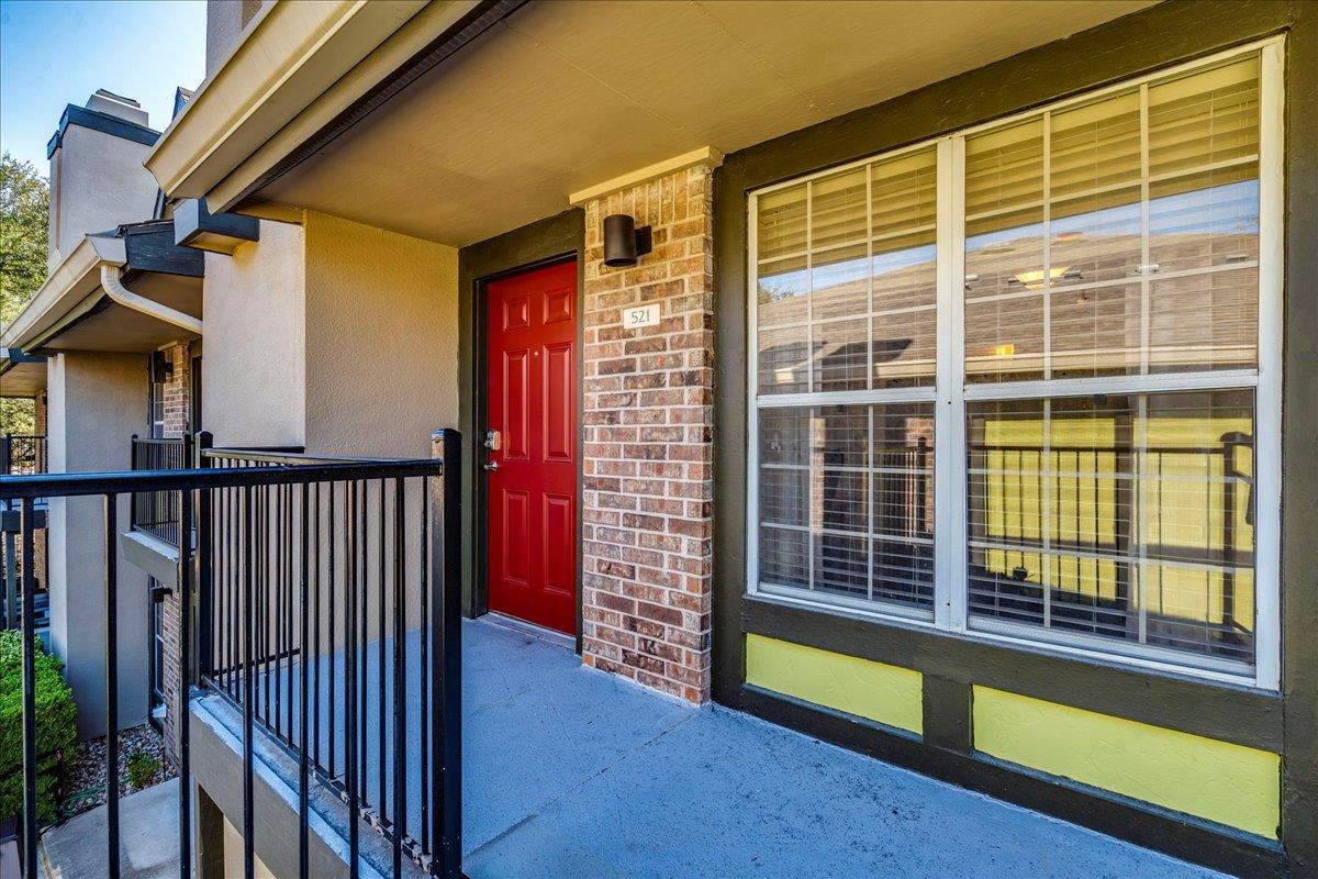 View of exterior entry featuring stucco siding, a
