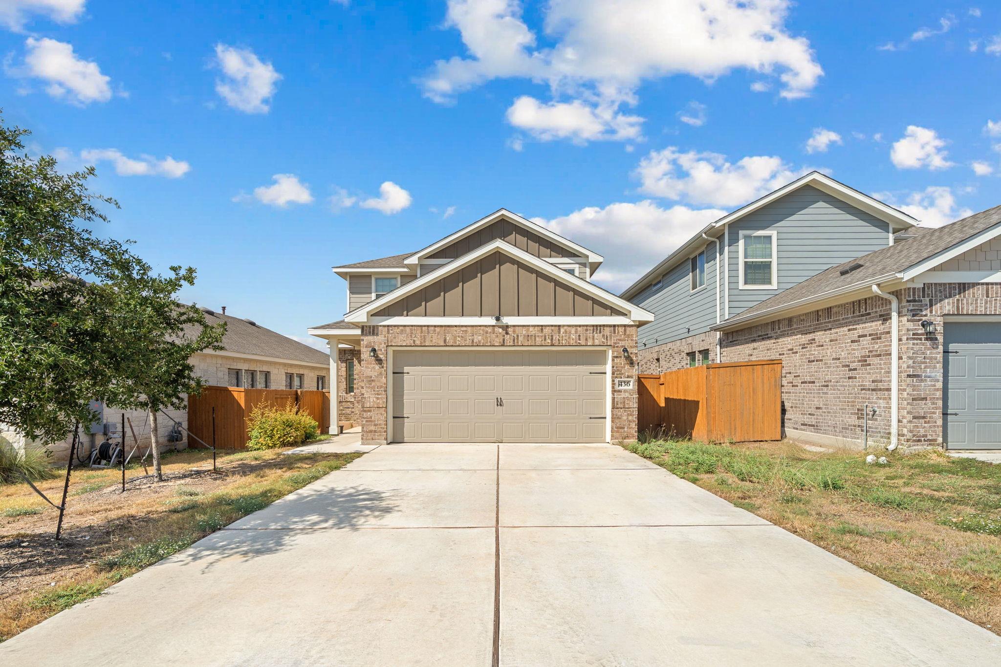 Craftsman inspired home with driveway, an attache