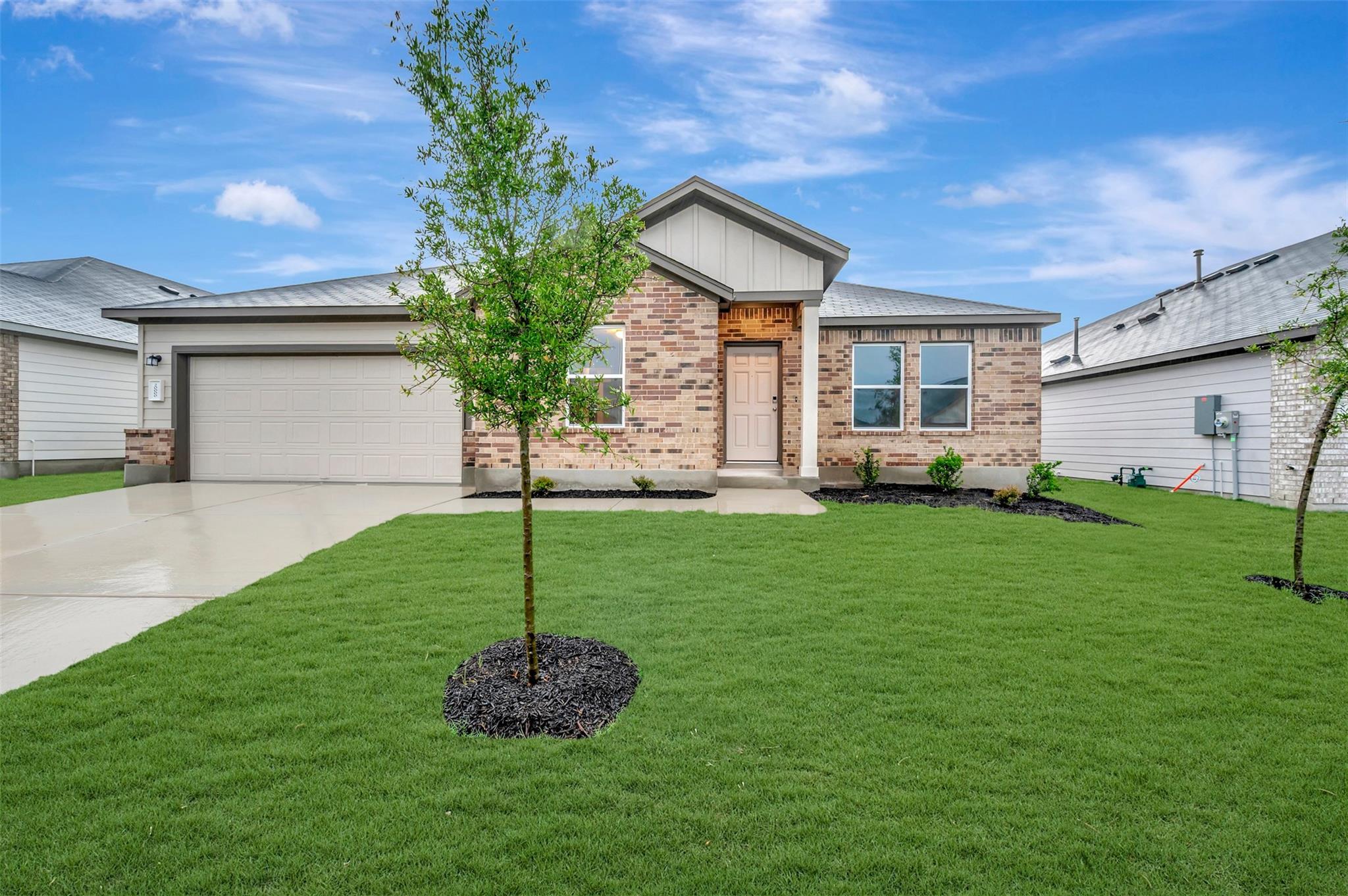 Contemporary single-story residence with a brick 