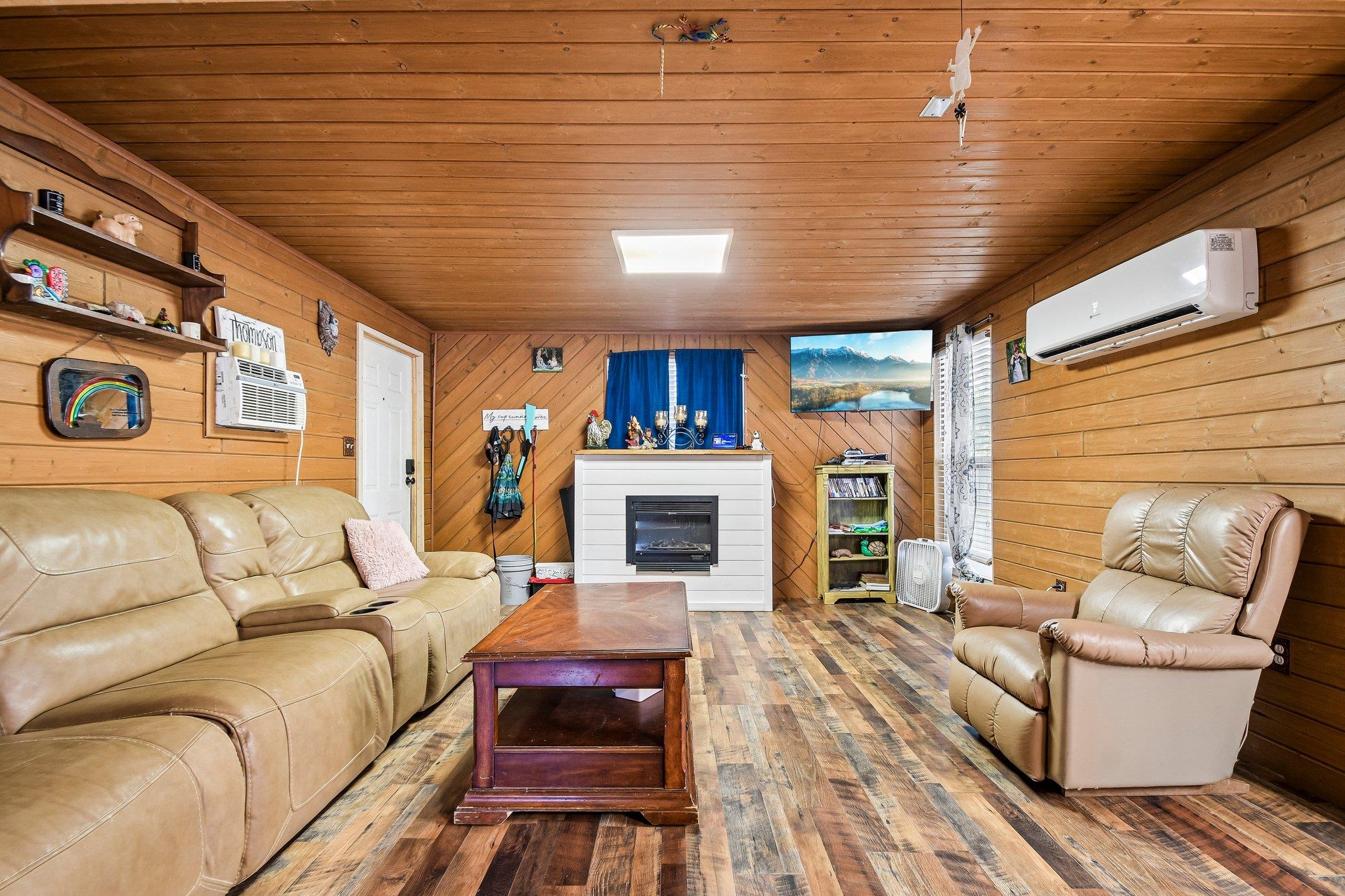 Rich wood planking lines the walls and ceiling of