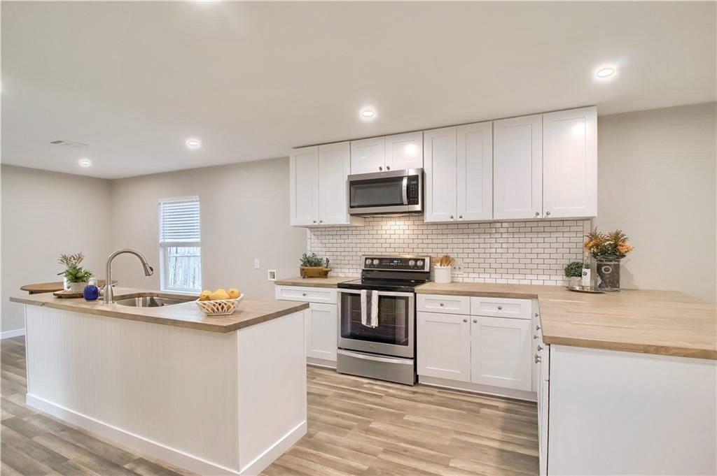 Open-concept kitchen featuring an island with an 