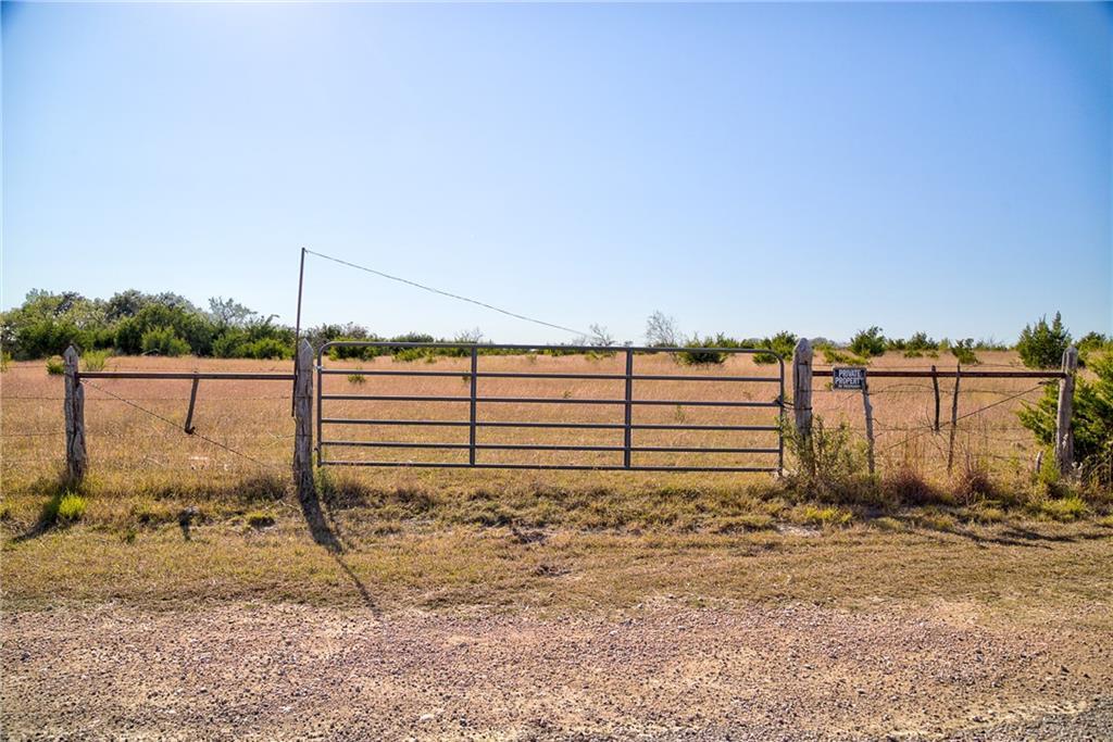 View of yard with a gate and a view of rural / pa