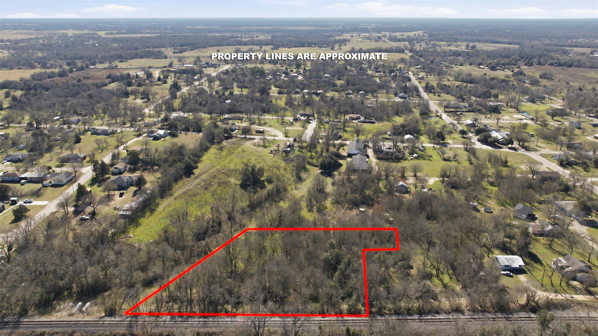 Aerial overview of property's location with prope