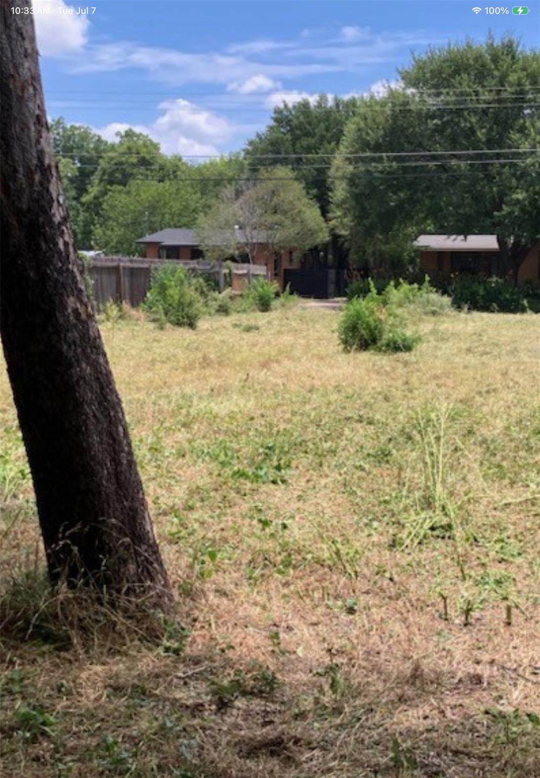 A spacious, untamed lot offers significant potent