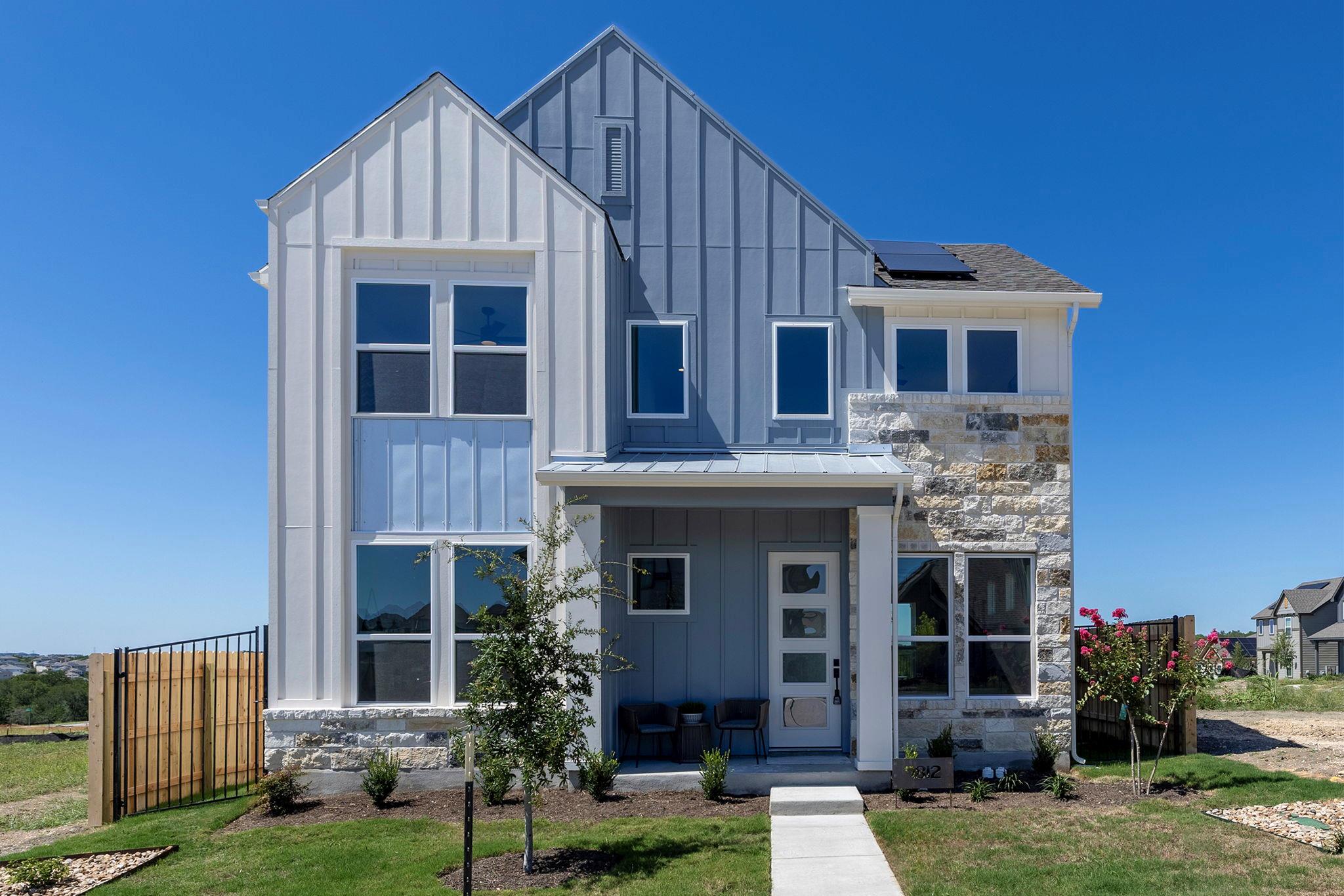 View of front facade with board and batten siding