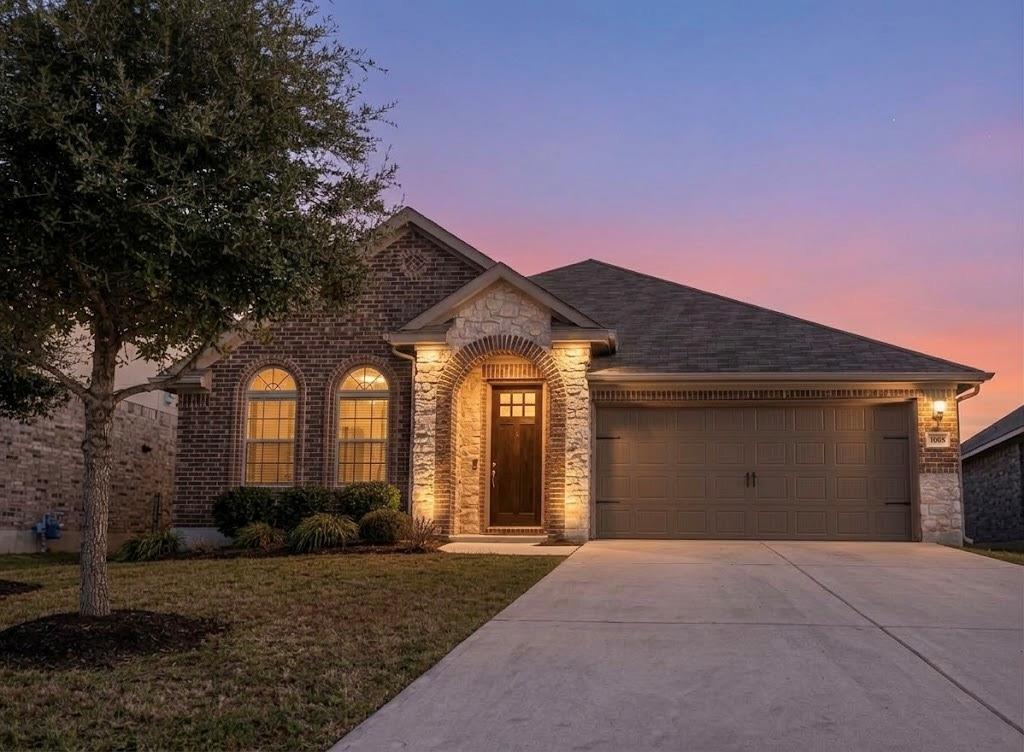 An arched entryway and detailed masonry create a 