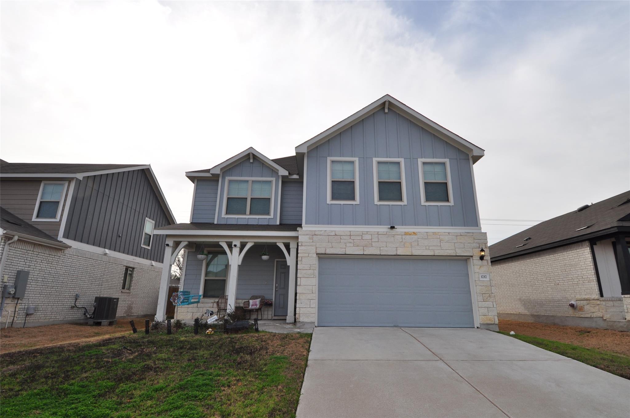 View of front of house featuring a porch, stone s