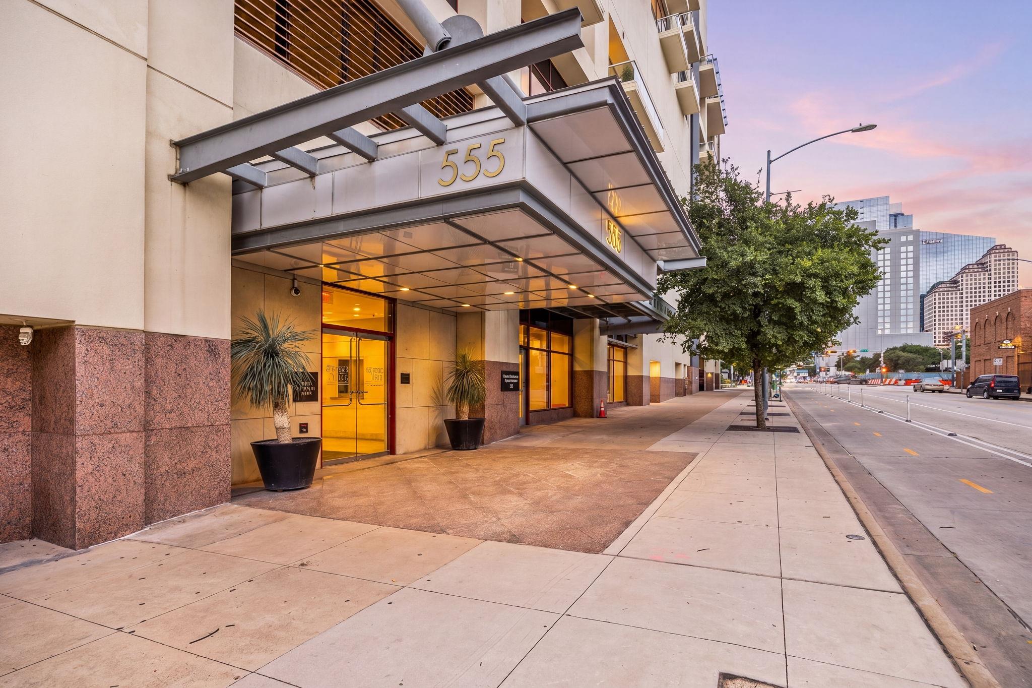A prominent entry canopy marks the building's fac