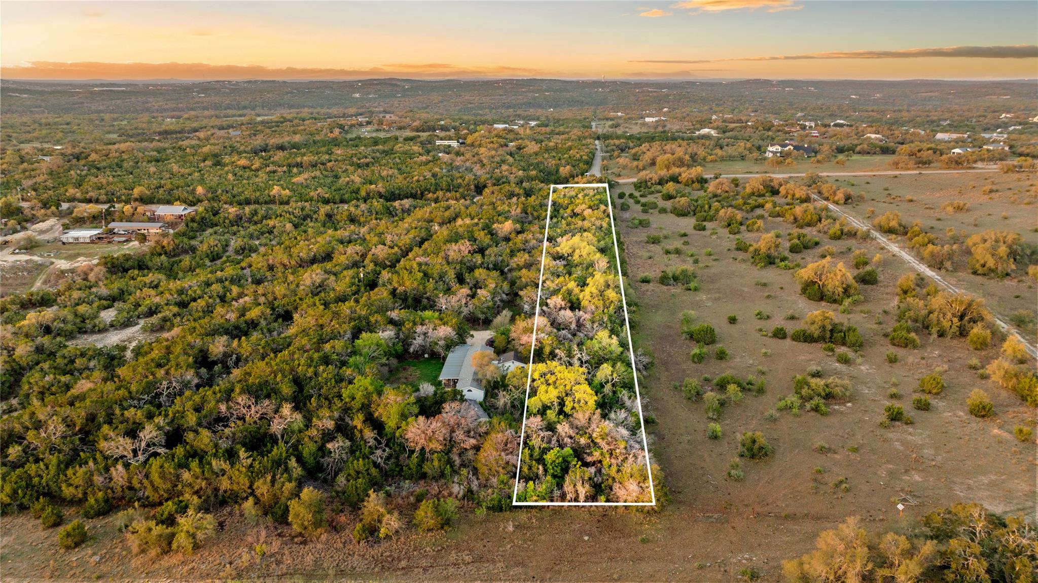 Aerial view at dusk of property boundaries highli