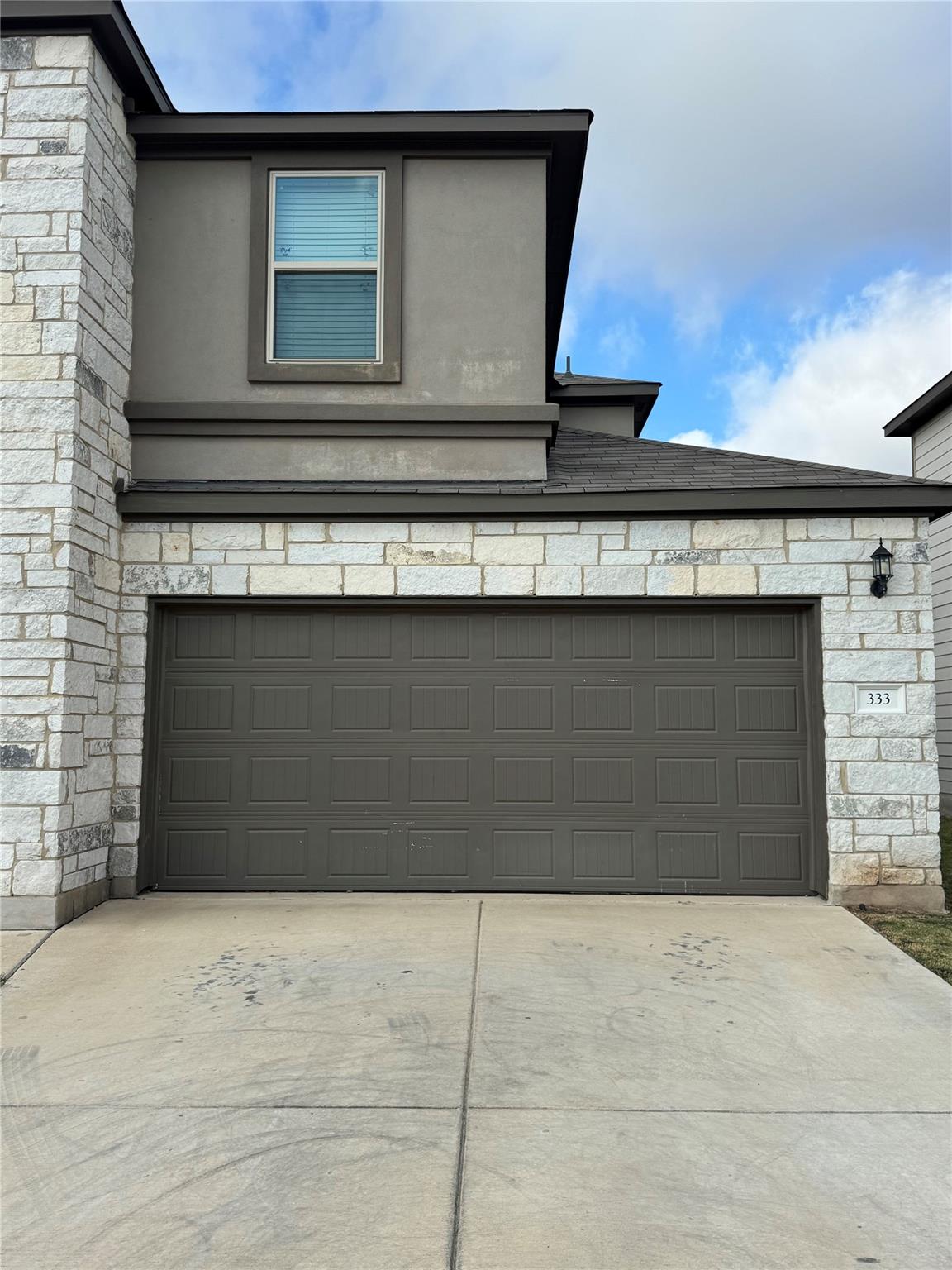 Garage featuring driveway