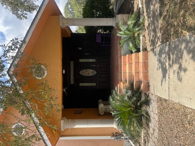 Doorway to property with a porch