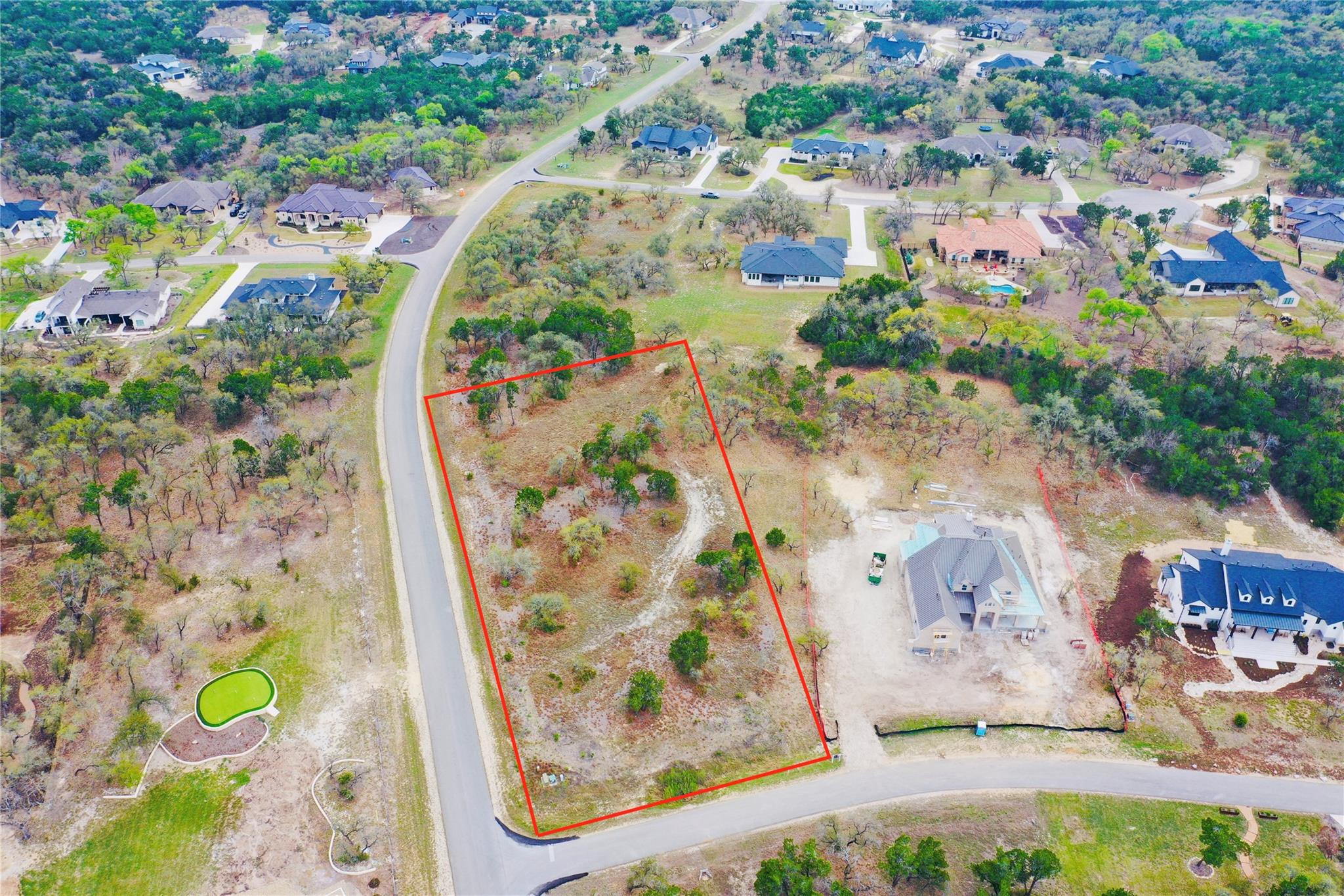 Aerial view of residential area with property par