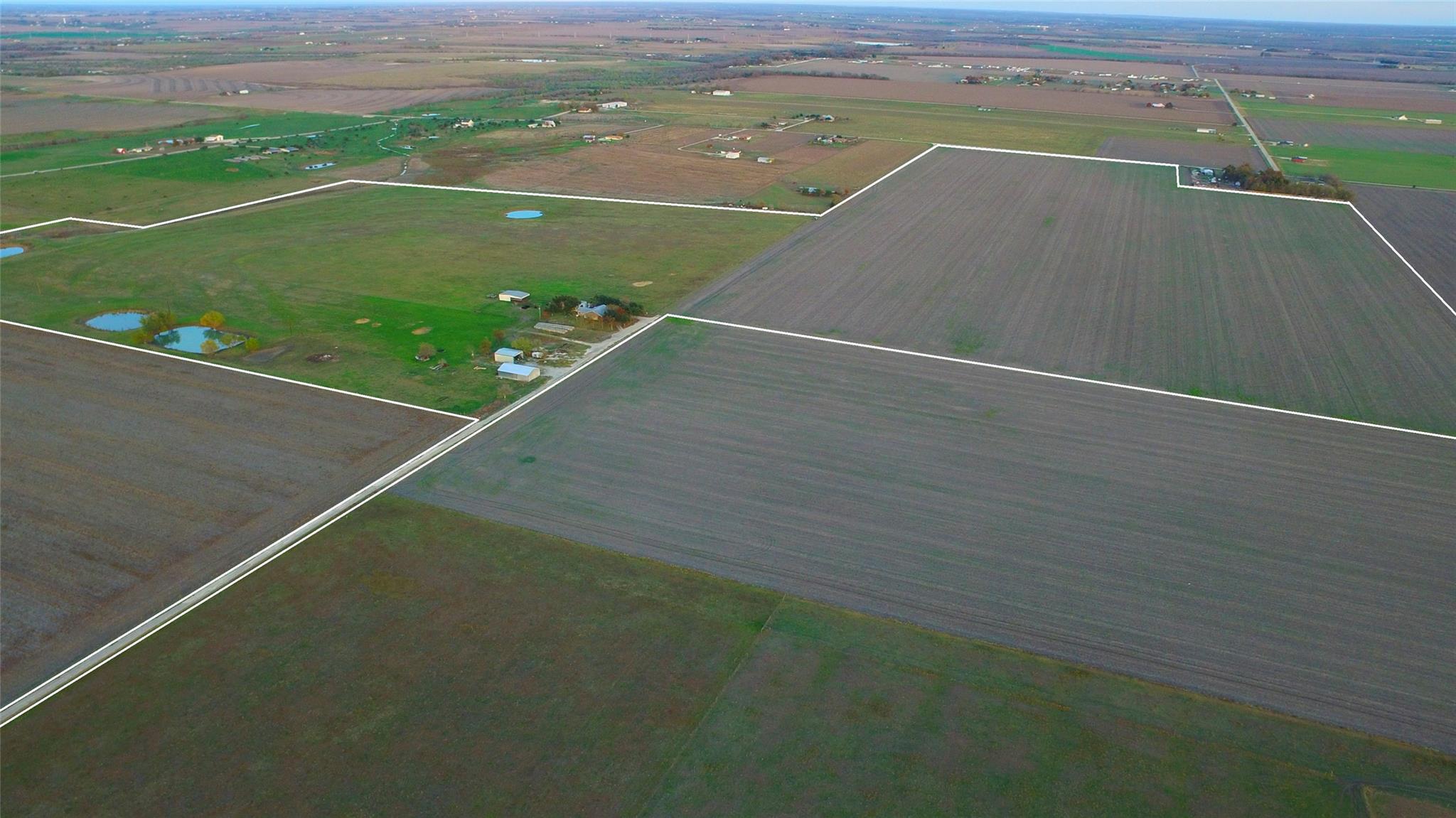 Aerial view of sparsely populated area with large