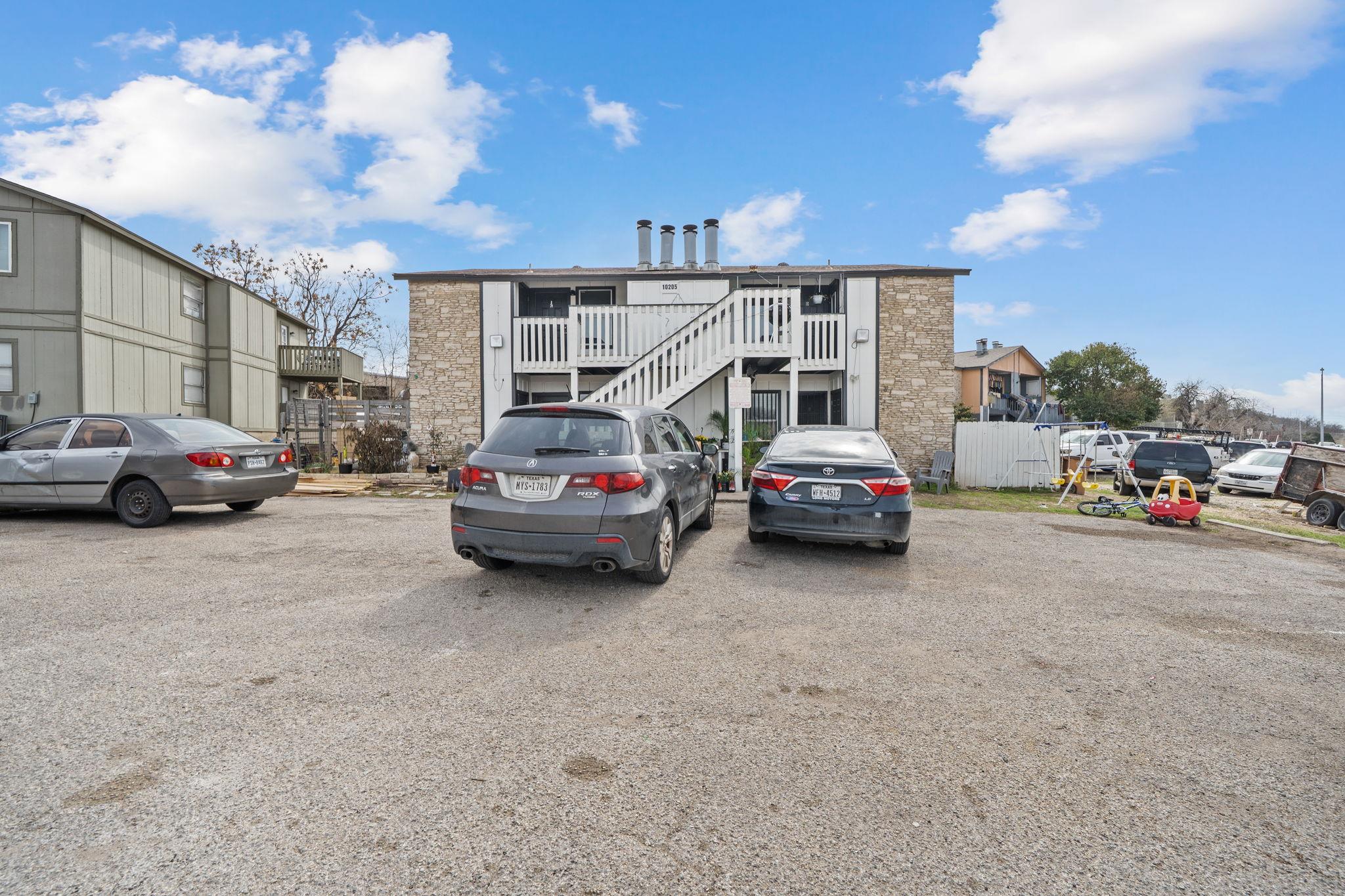 View of building exterior with stairway and uncov
