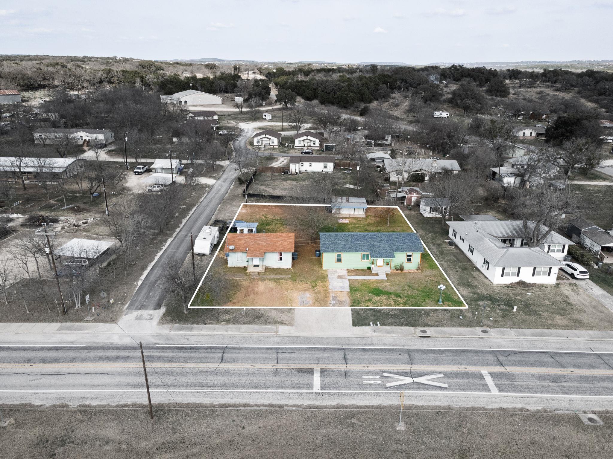 Aerial view of residential area with property par