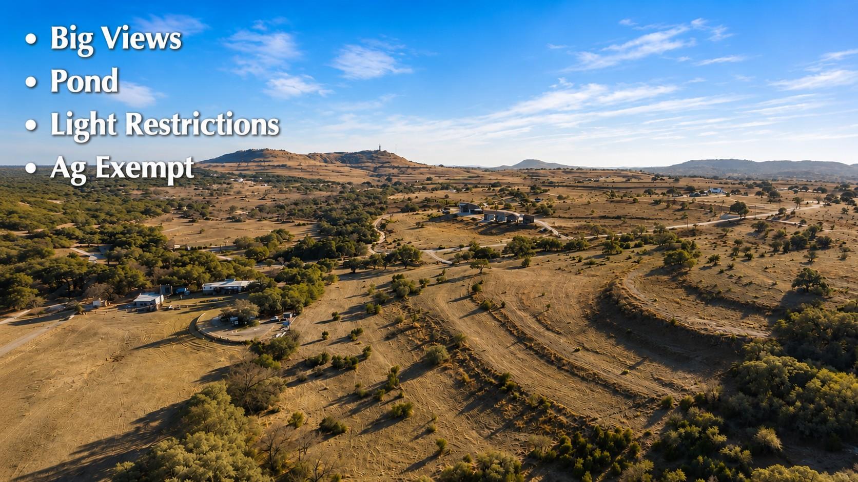 A sprawling landscape reveals gentle slopes, matu