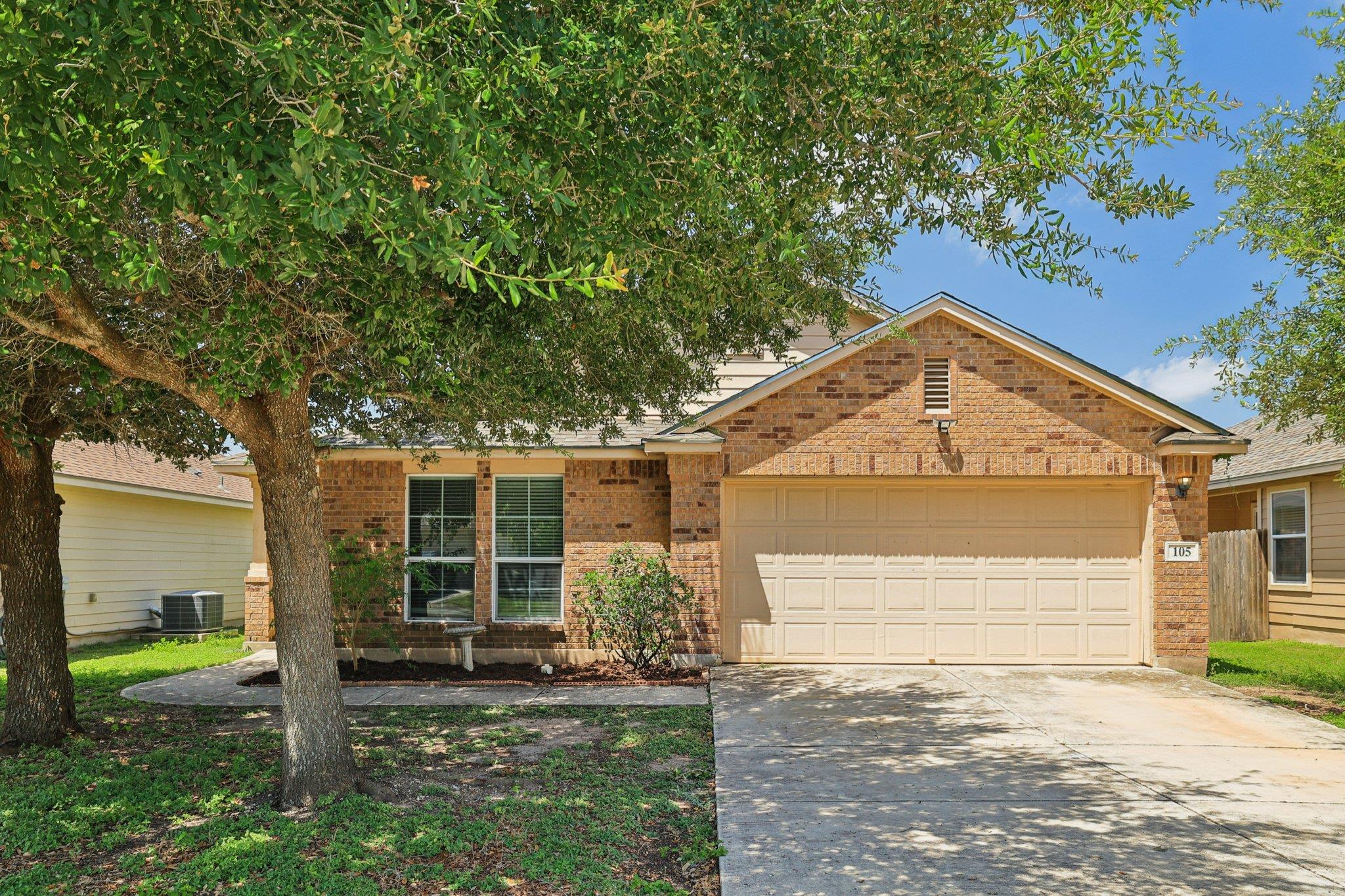 View of front of property with brick siding, an a