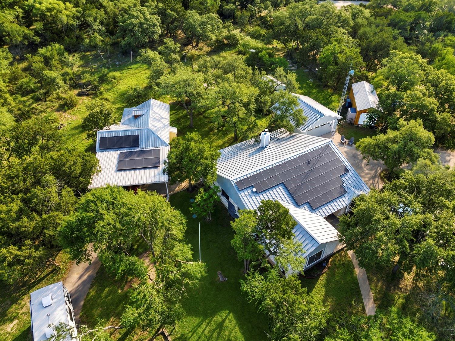 An aerial perspective showcases this home nestled