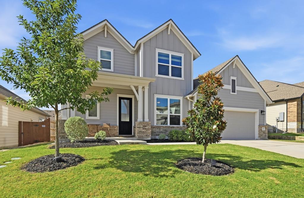 A well-maintained lawn and mature trees enhance t