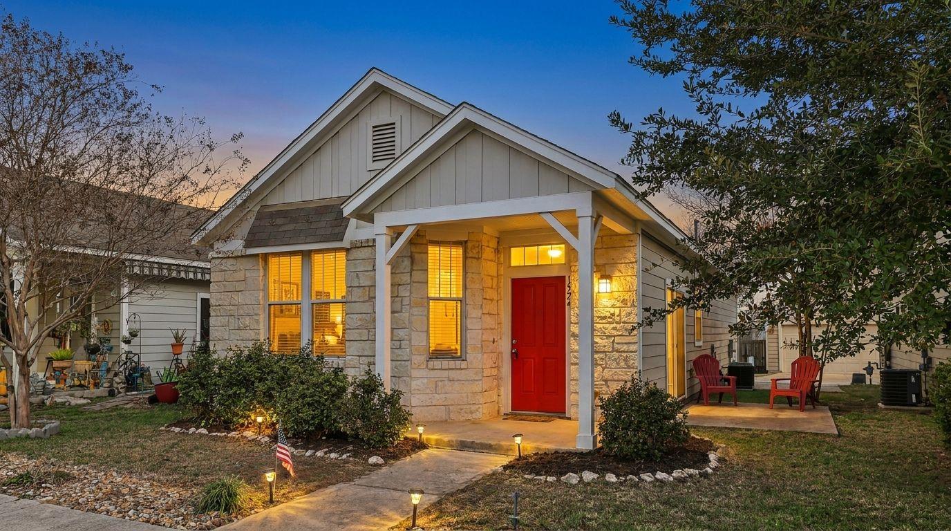 Stone and siding exterior featuring a covered ent