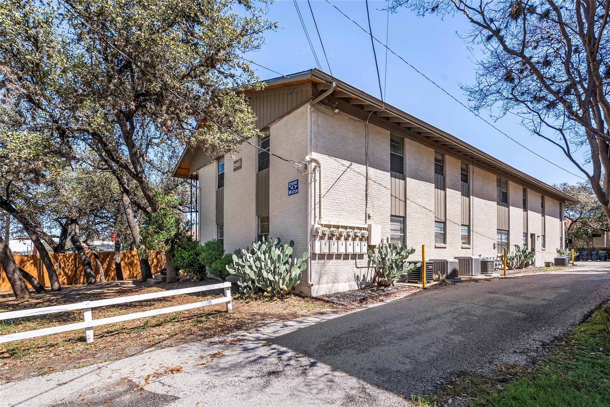 View of home's exterior with brick siding and a c