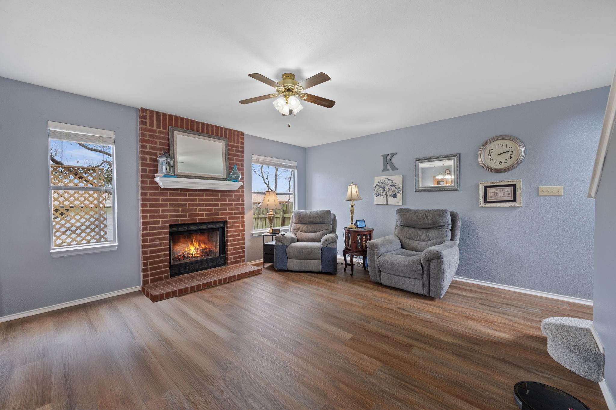 A comforting ambiance fills this living room, fea