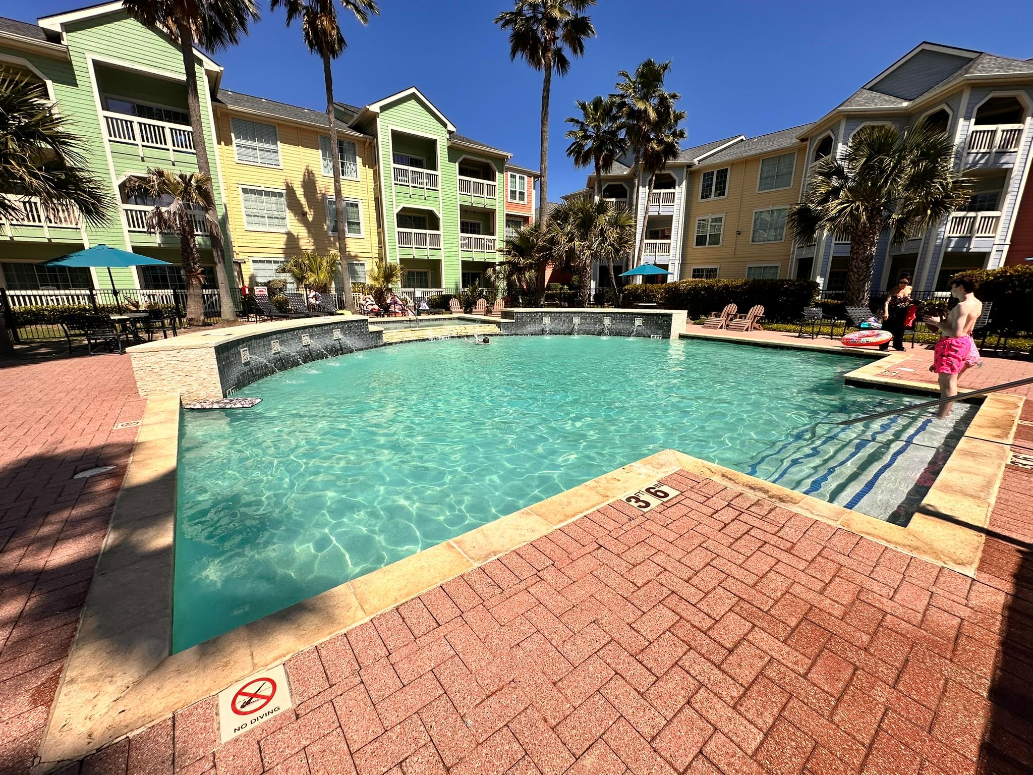 Community pool featuring a patio area
