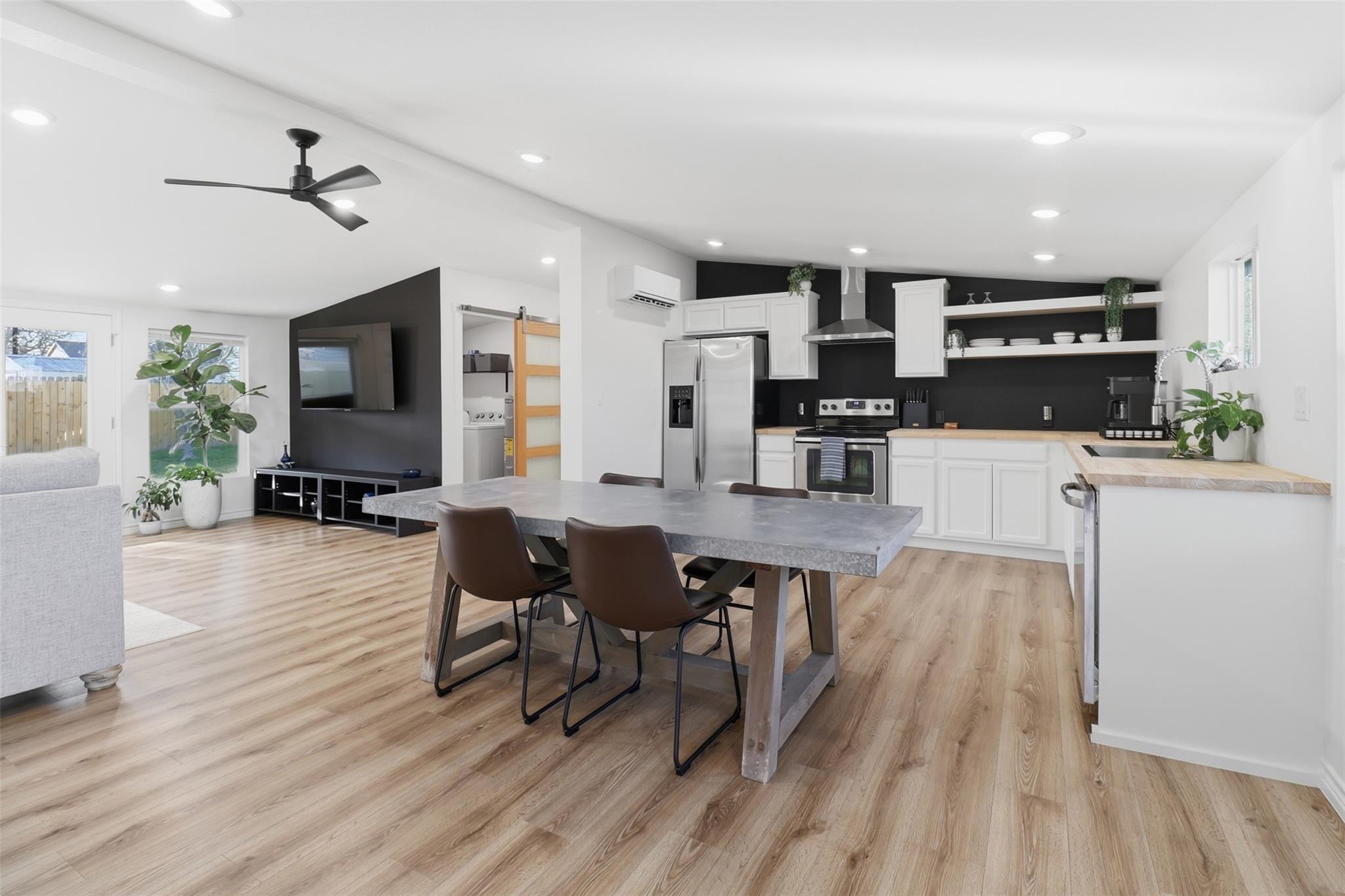 Kitchen with a barn door, vaulted ceiling, health