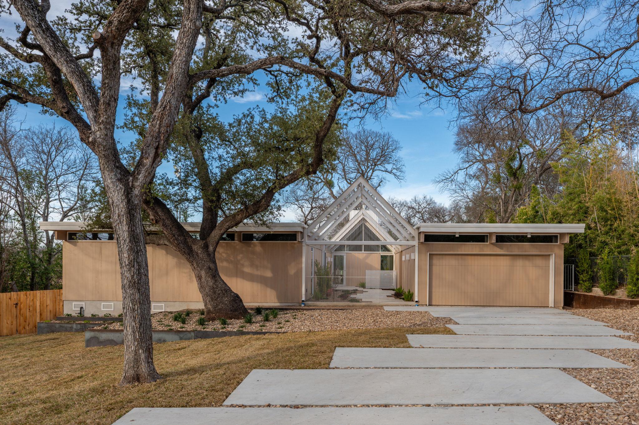 Mid-century modern home with an attached garage a