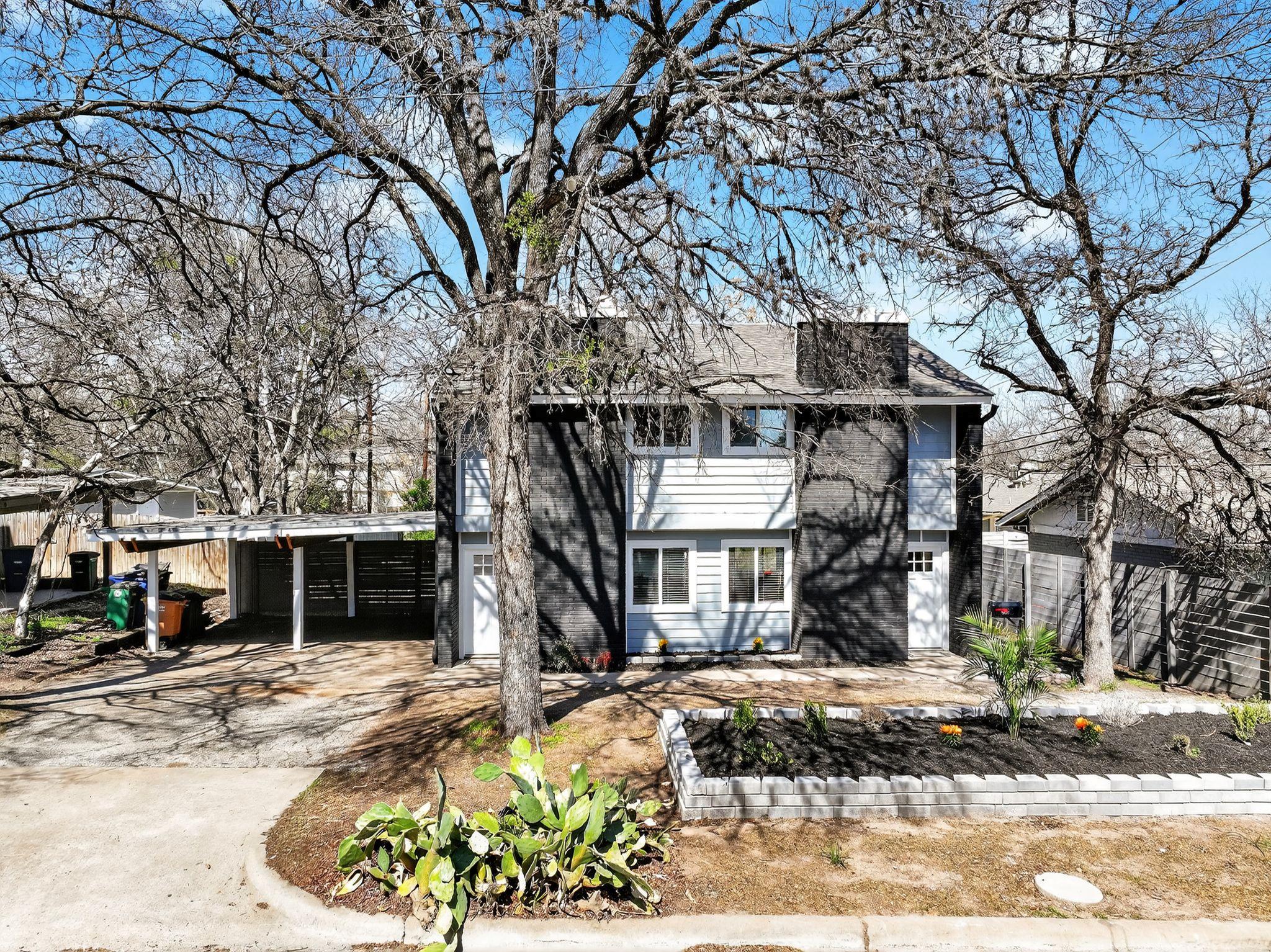 View of front of property featuring a carport and