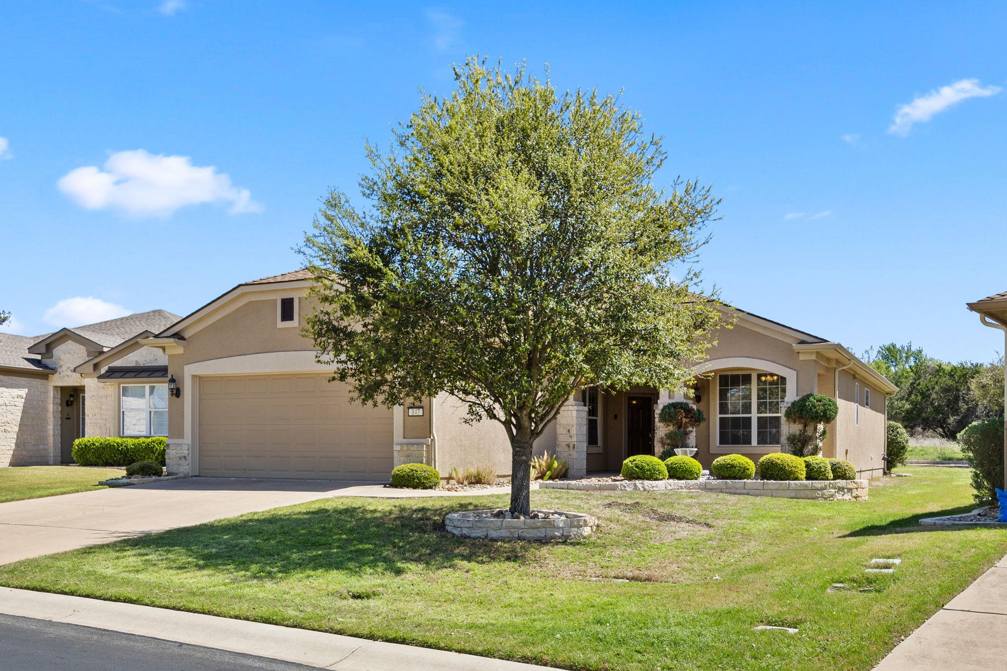 View of front of home featuring stucco siding, a 