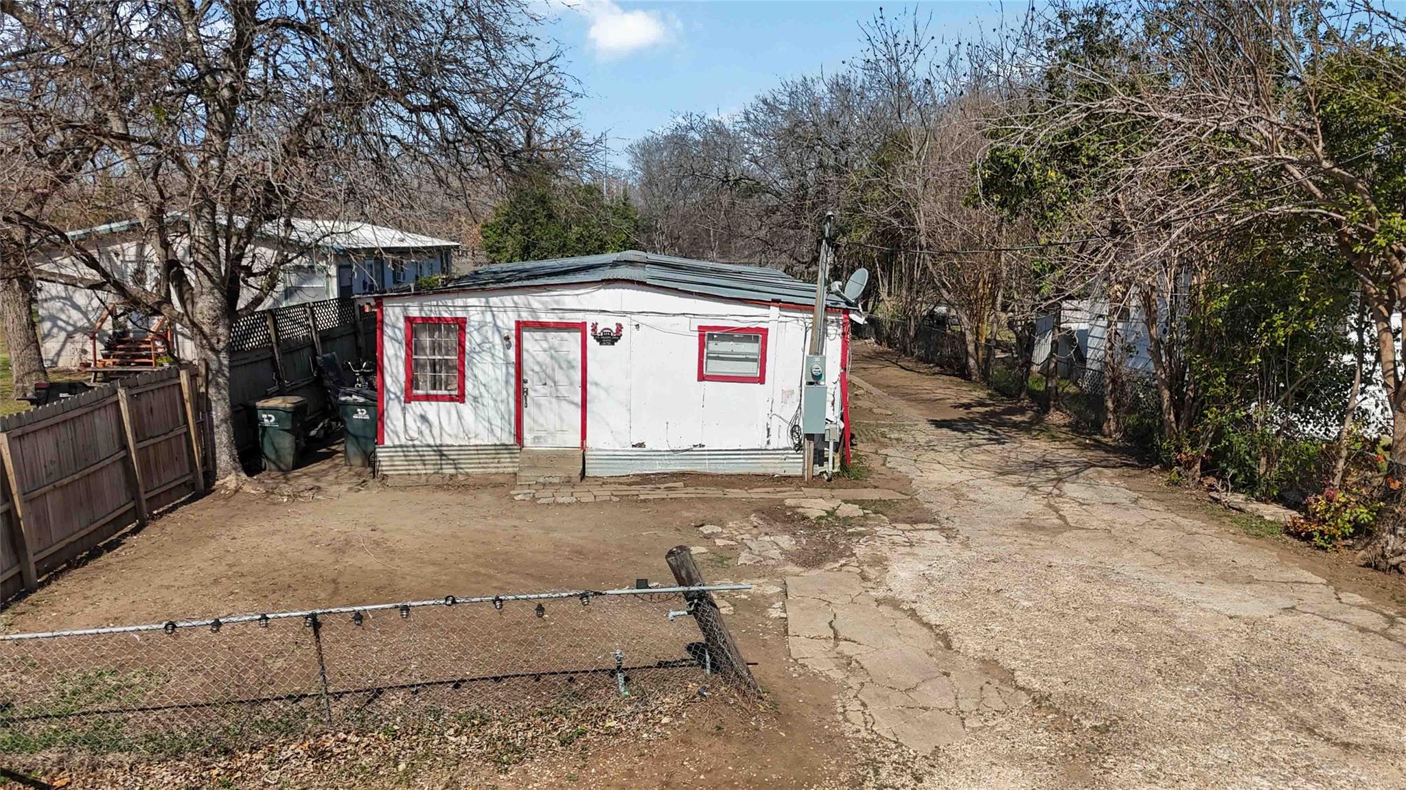 View of outbuilding featuring driveway