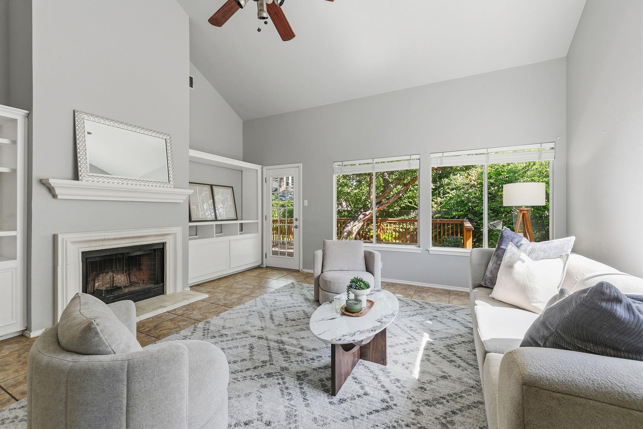 A fireplace takes center stage in this bright liv