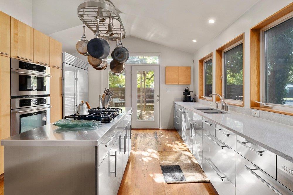 Kitchen featuring stainless steel counters, lofte