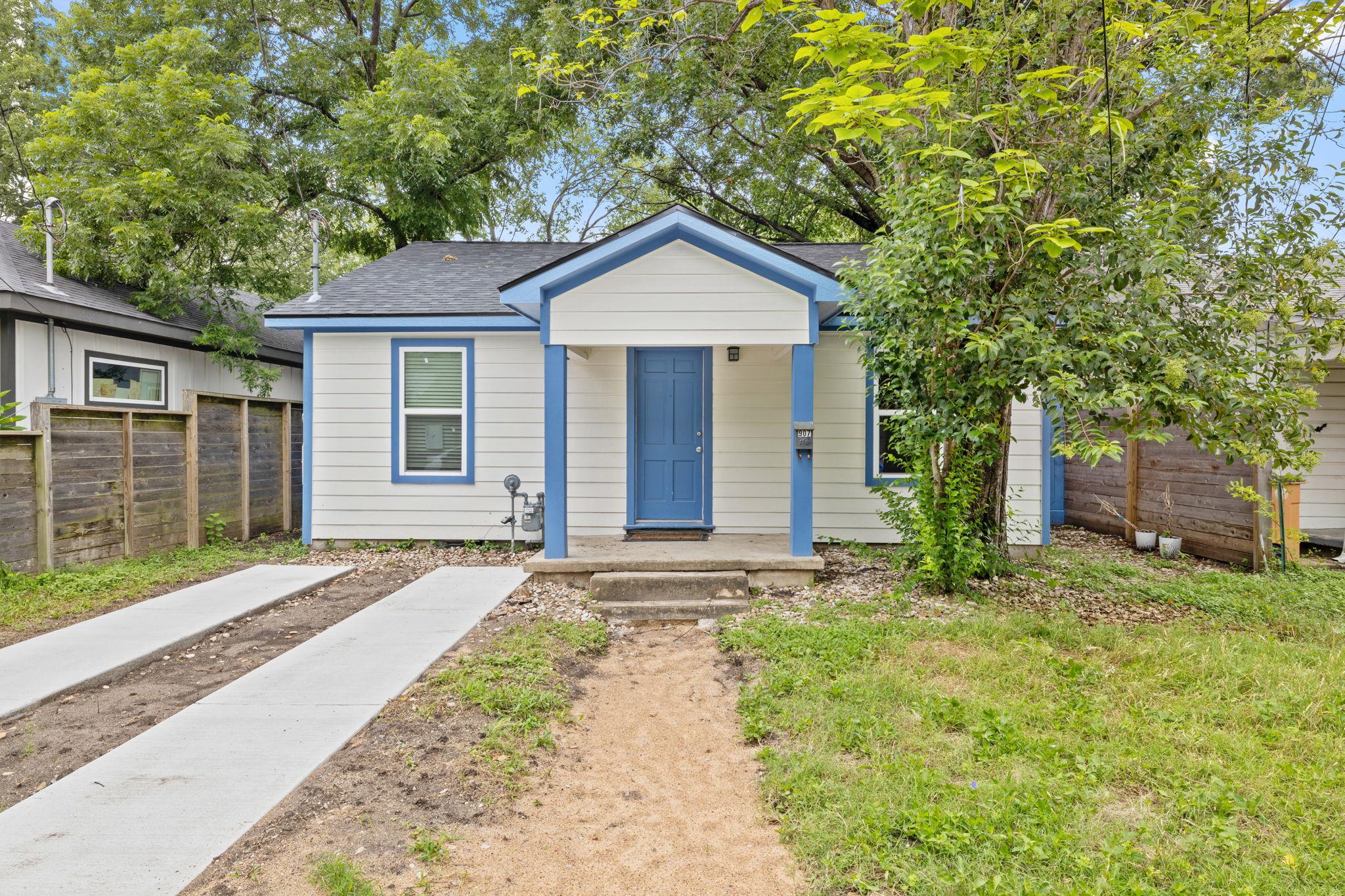 A charming single-story residence boasts a vibran