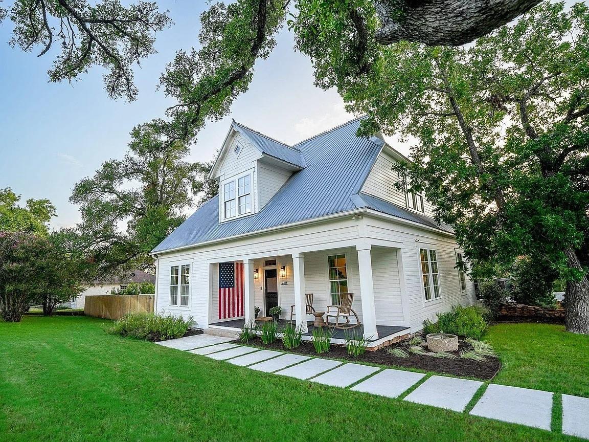 View of front of house with covered porch and a m