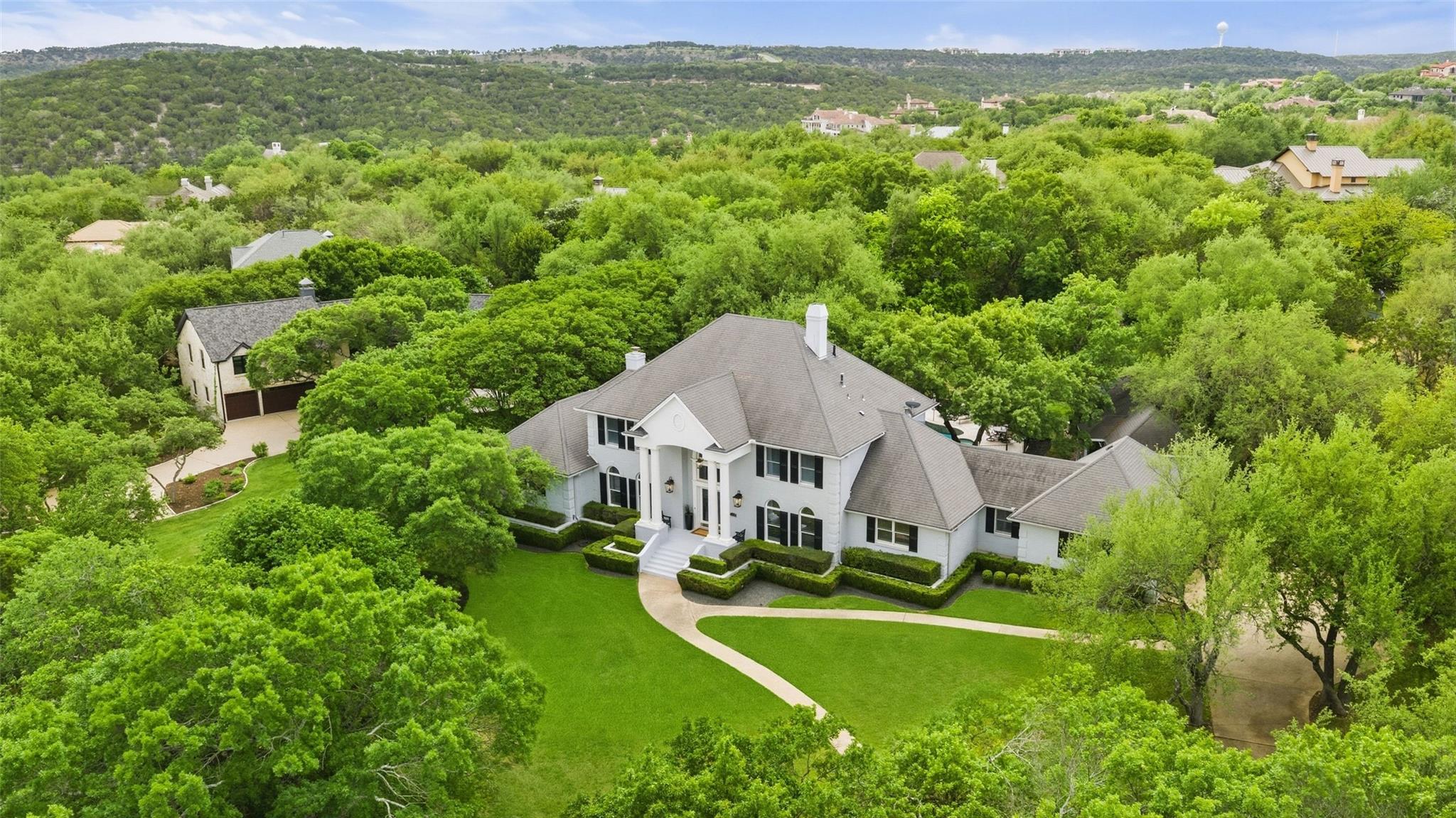 White exterior residence featuring a prominent co
