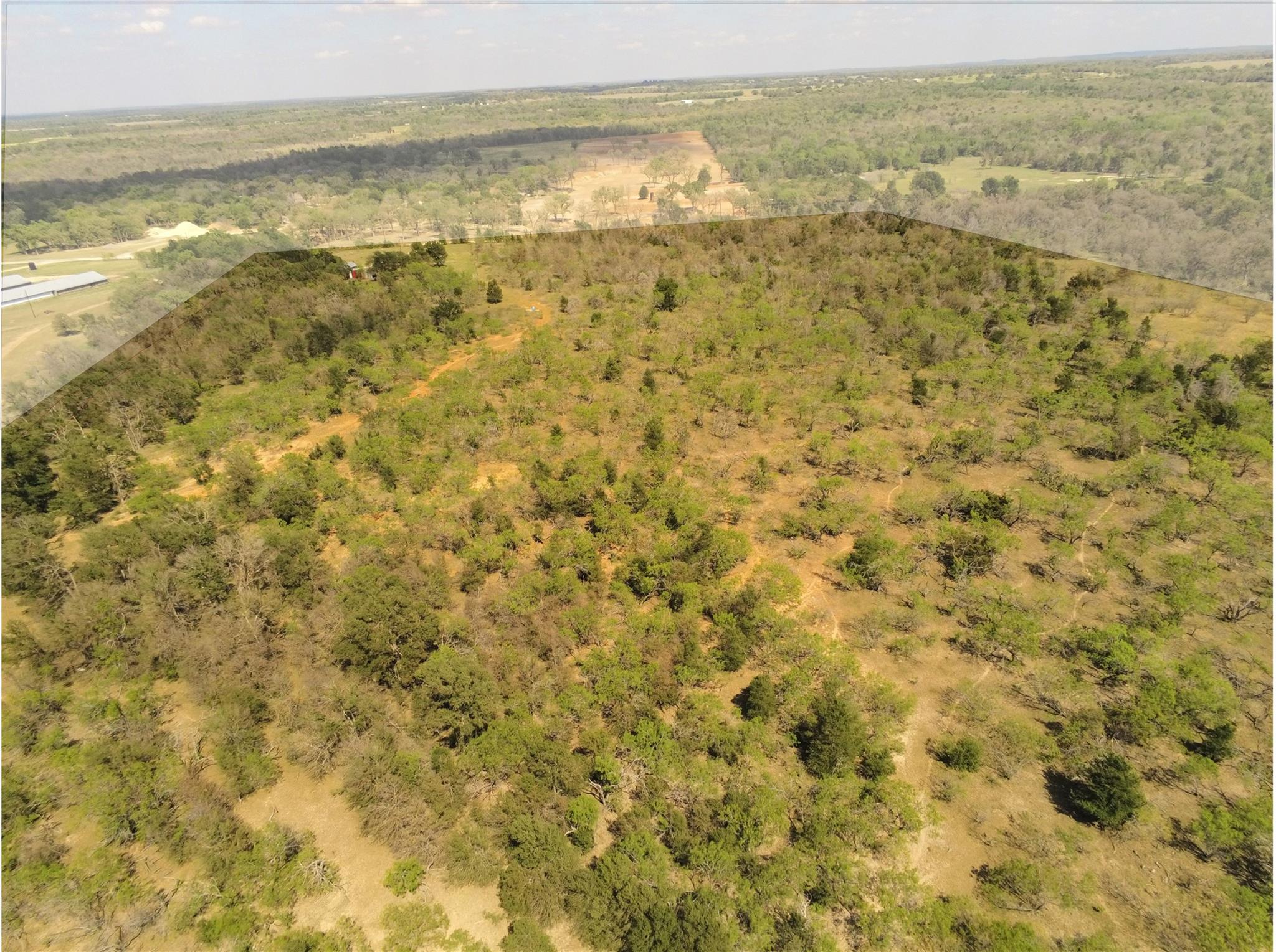 Expansive land parcel featuring varied terrain wi