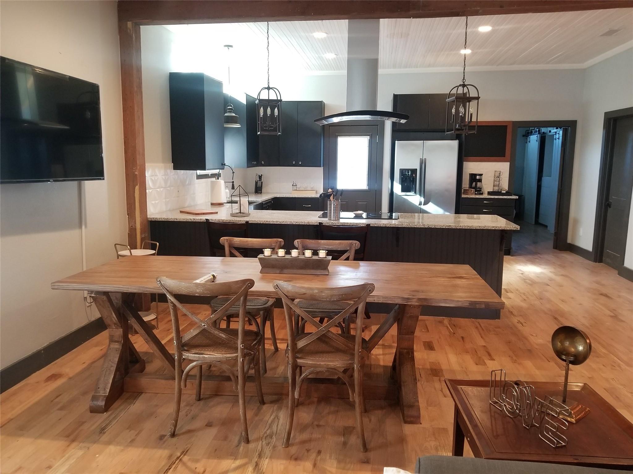 Kitchen with island range hood, decorative light 