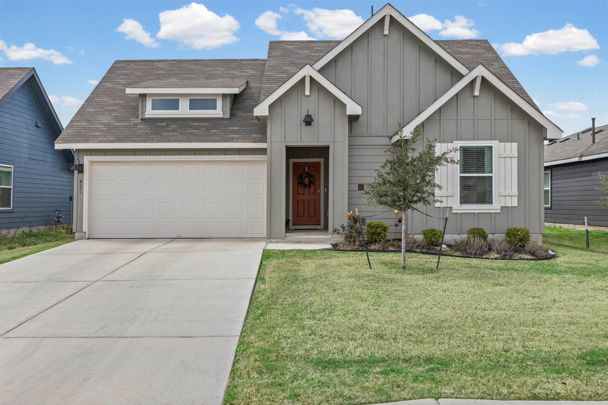 View of front of property featuring a shingled ro